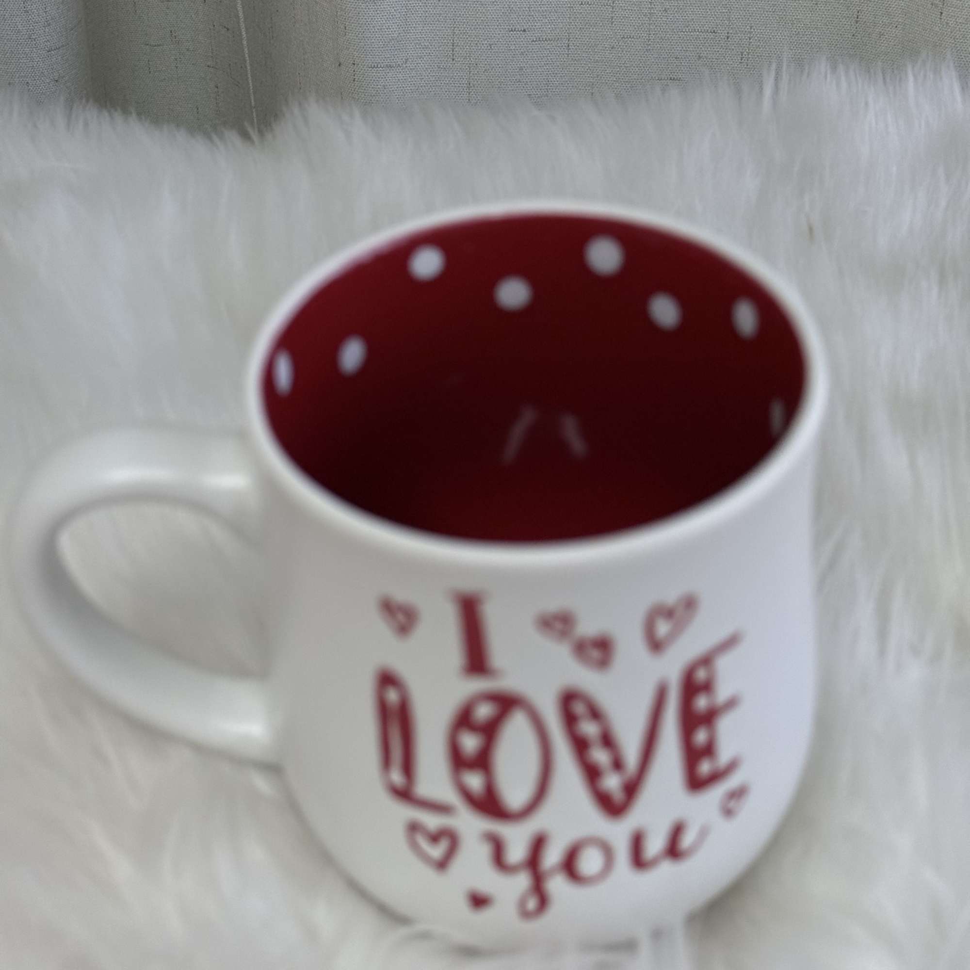  A romantic and delicate floral arrangement presented in a charming LOVE