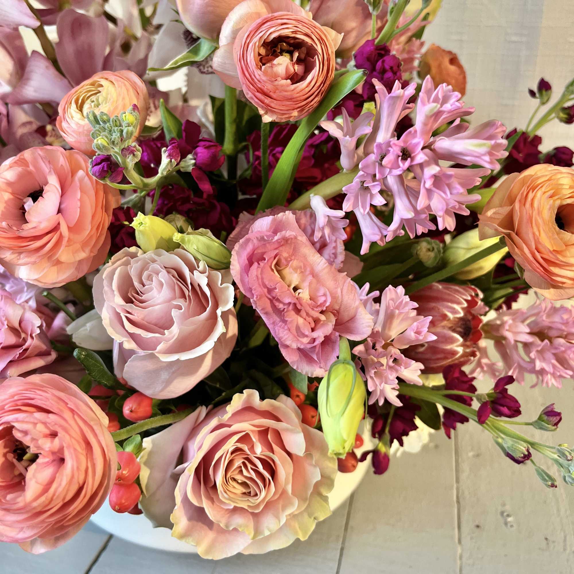 Hearts Aflame is a lush arrangement composed of seasonal locally sourced flowers