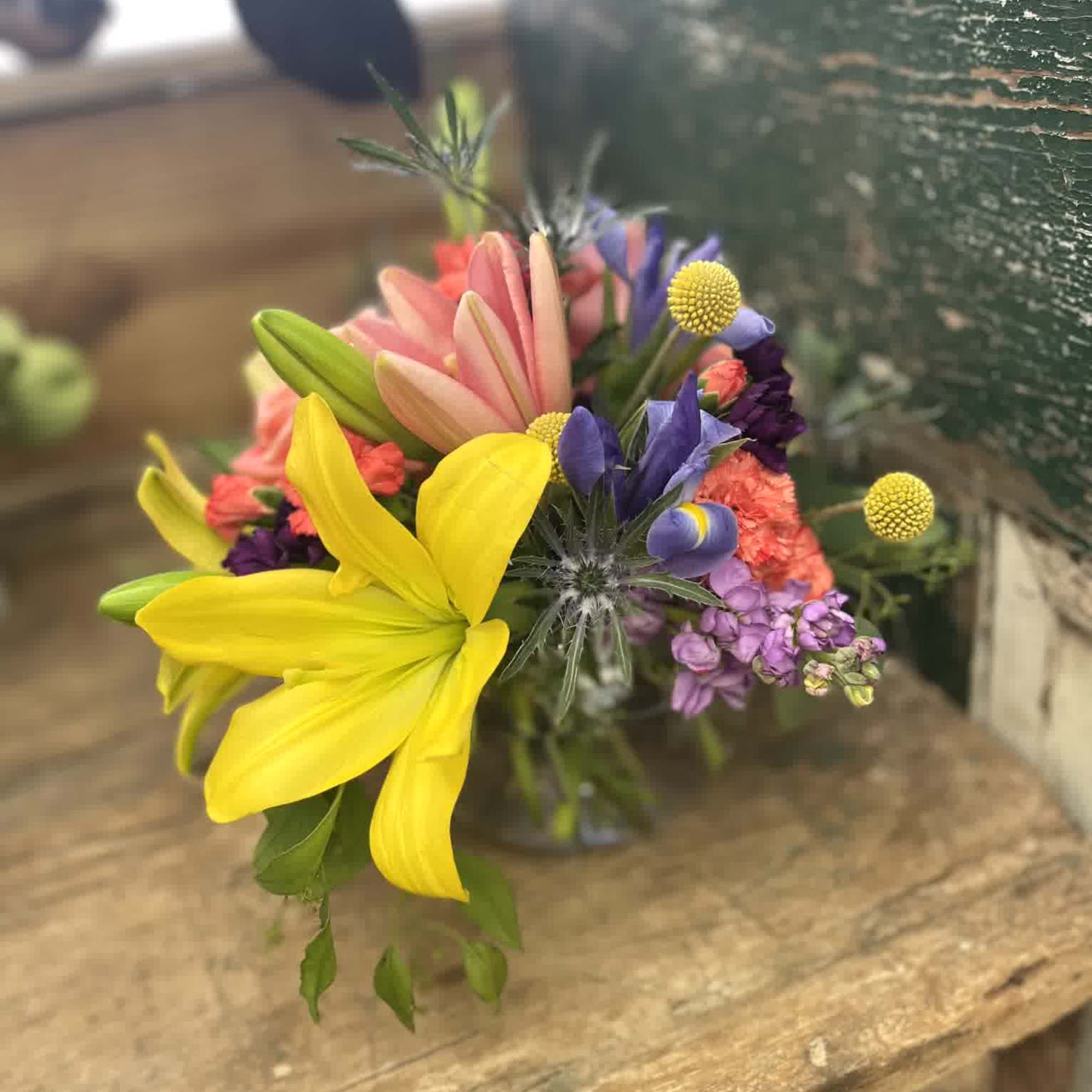 Stunning roses, Lilies, Stock, Iris, Billy Balls, Thistle, and carnations make a