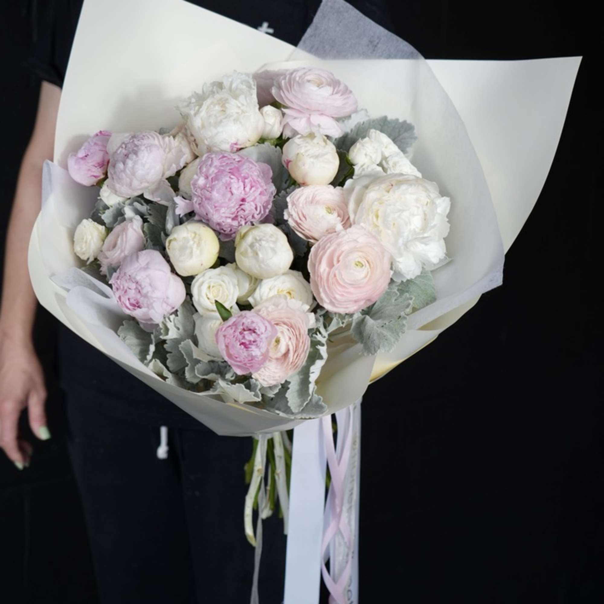 The Whispering Elegance Bouquet is a stunning arrangement that radiates sophistication and