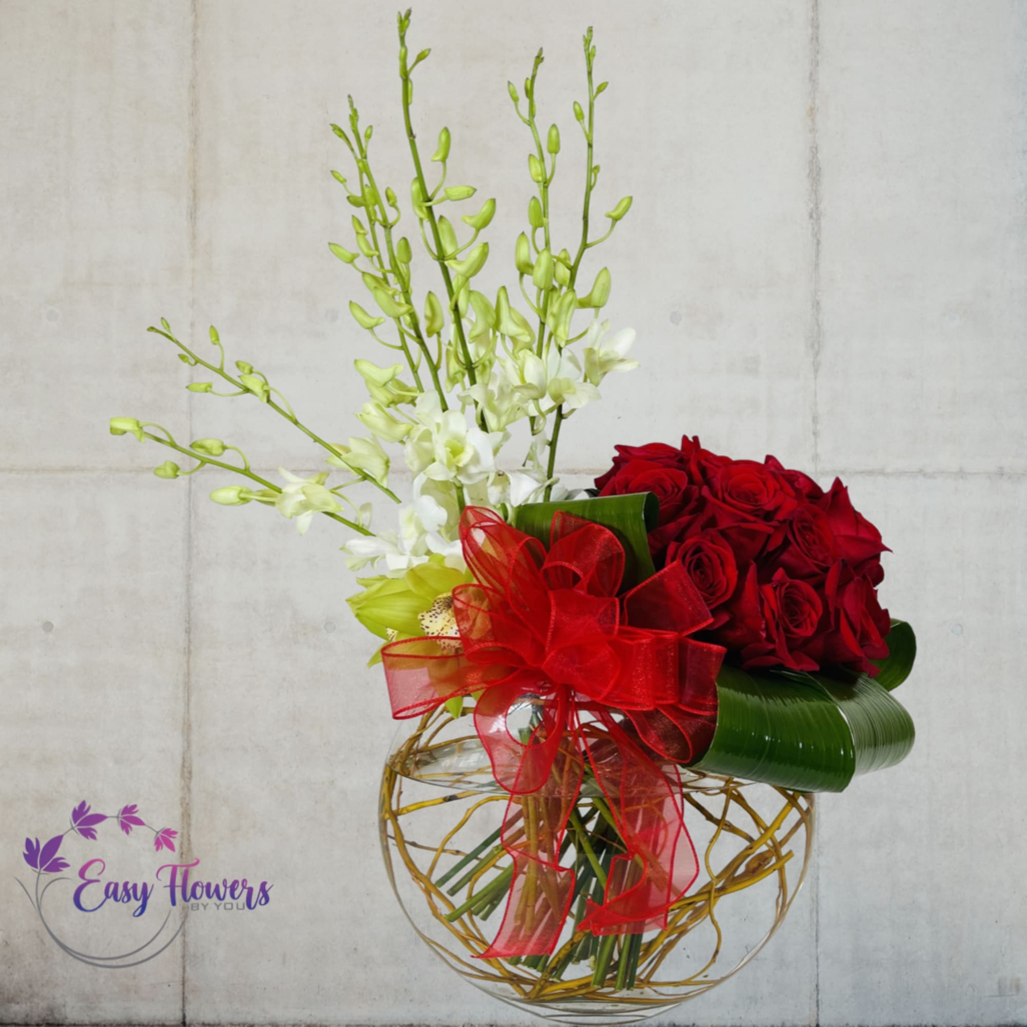 Fall in Love with Our Stunning Orchid and Red Rose Bouquet -