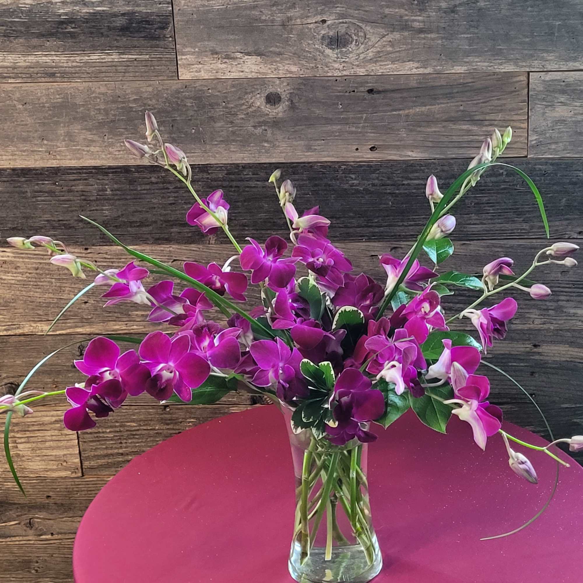 This array of orchids is sure to bring a smile to that