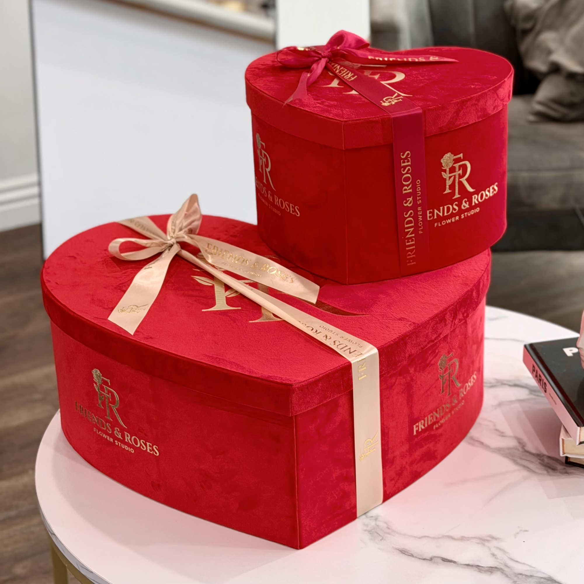 A large heart of velvety red and delicate ivory roses, designed to