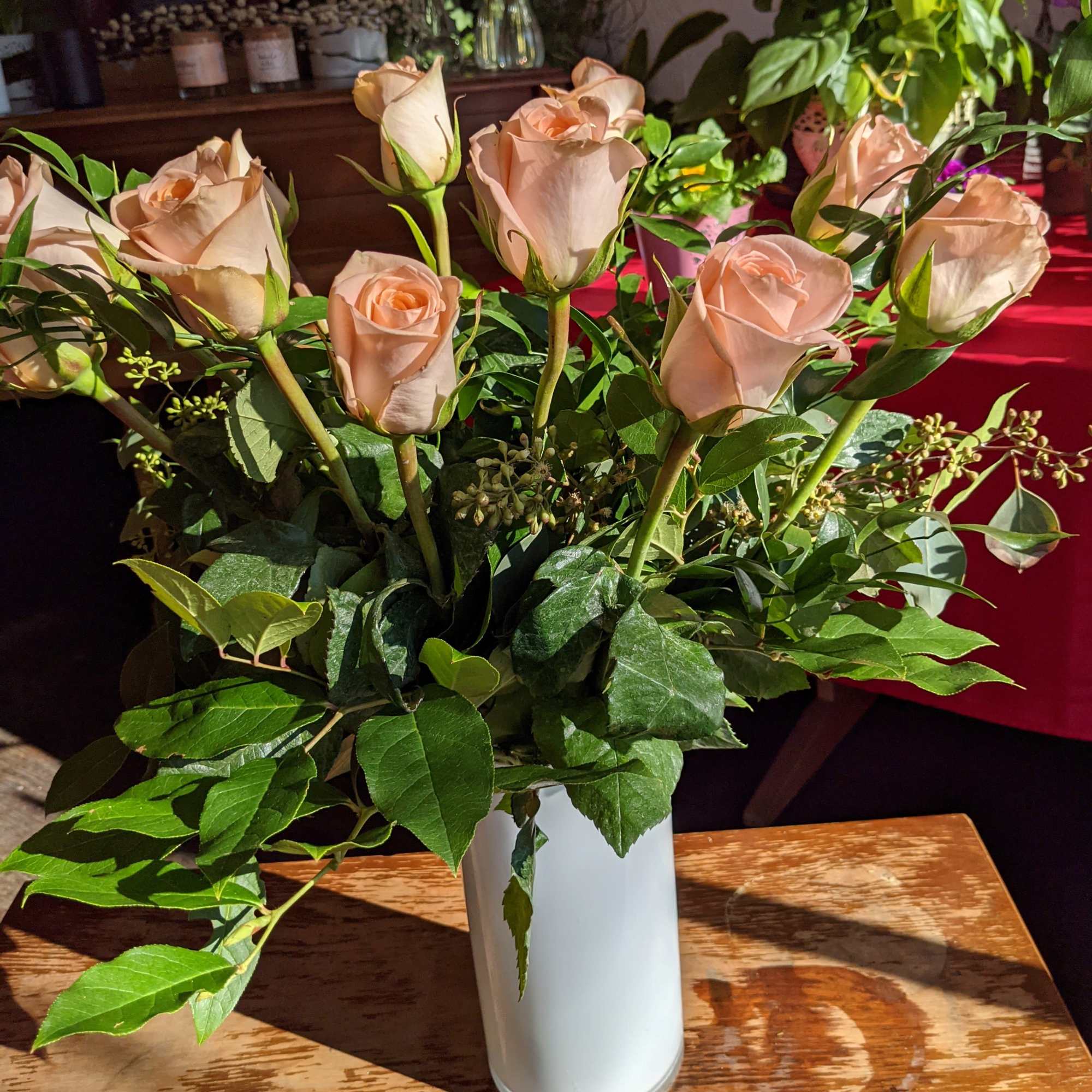 A timeless classic, send a dozen roses in a vase with complementing