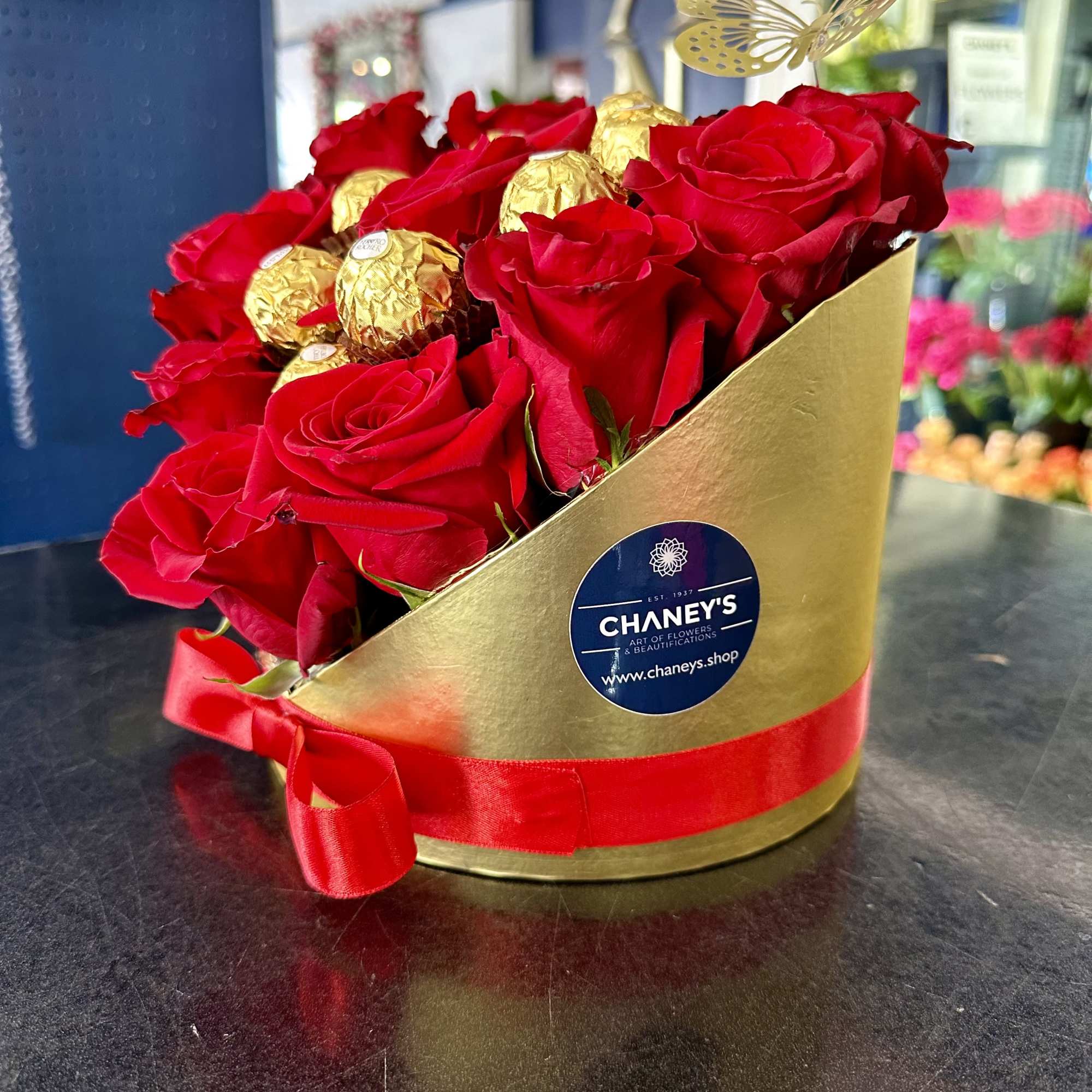 3D hand arranged floral box design with a dozen red roses and