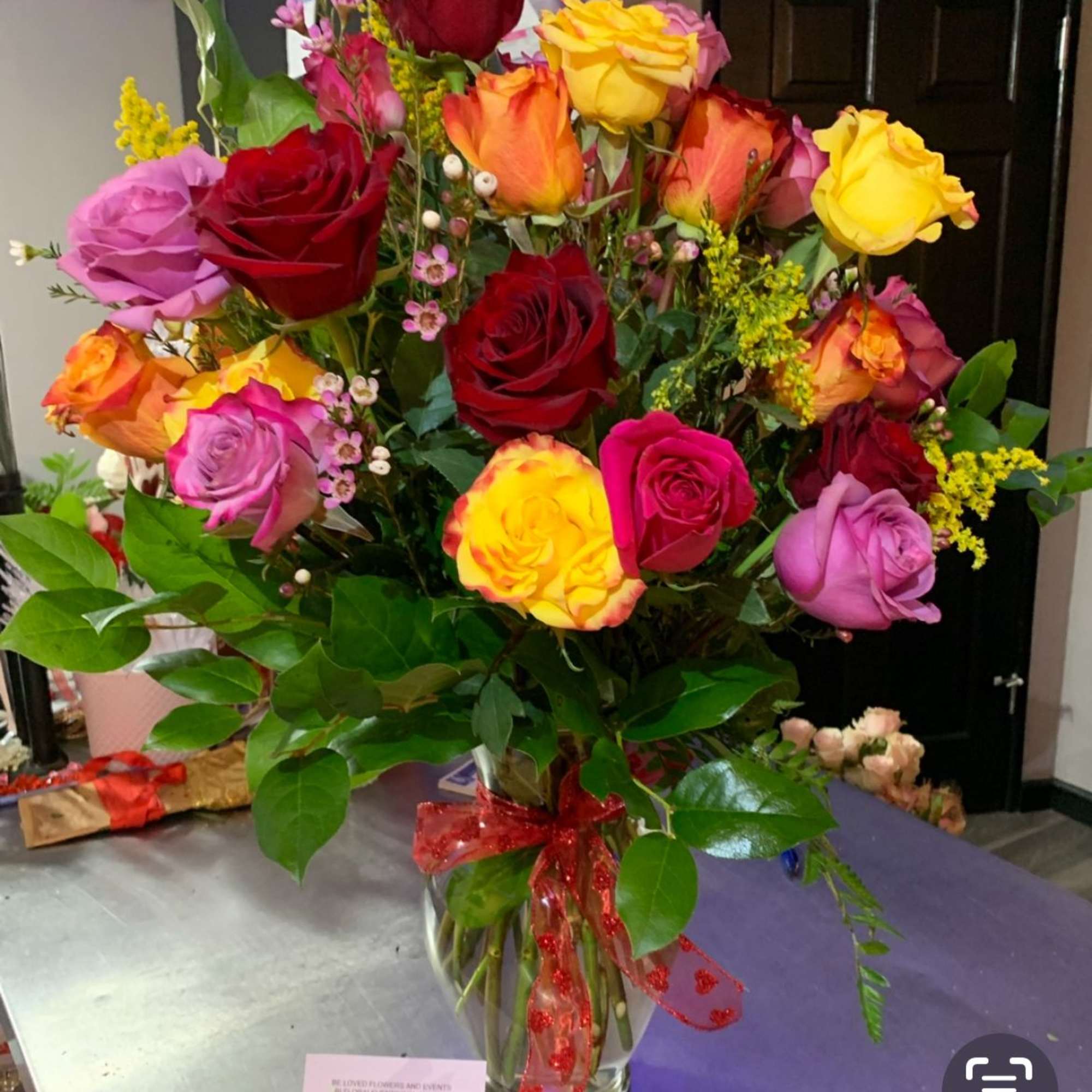 A vibrant celebration of love &amp; joy, this lush arrangement features premium