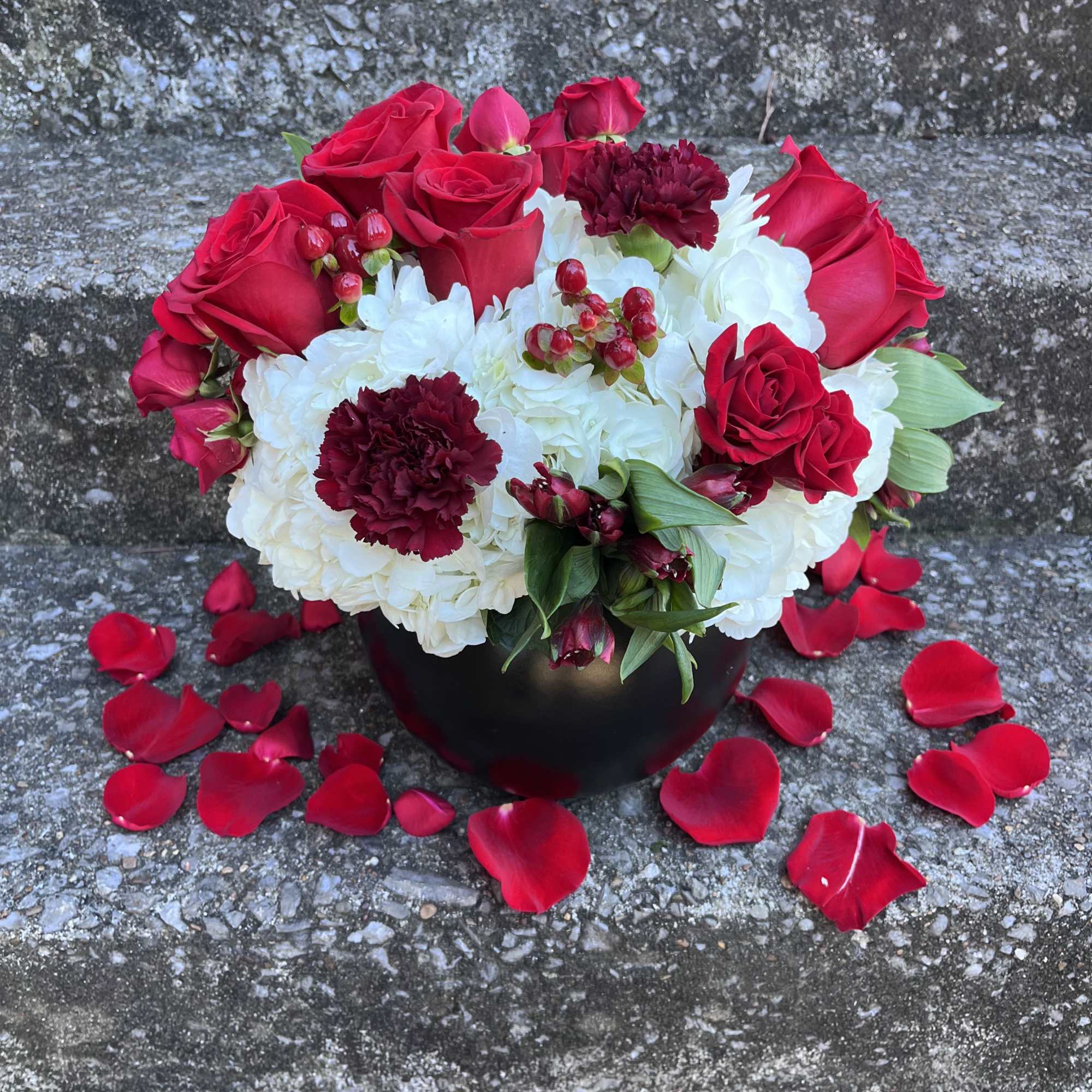 This beautifully designed arrangement is filled with hydrangeas roses, alstroemeria, spray, roses