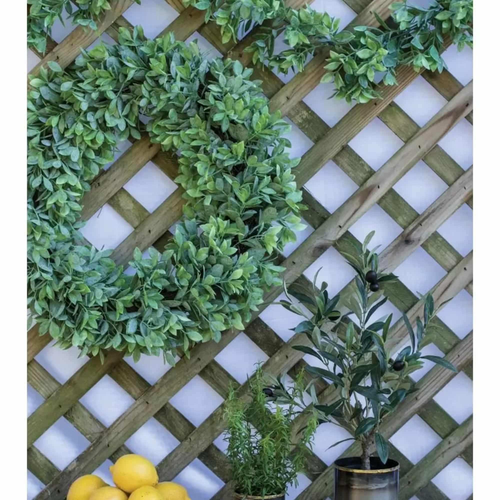 Understated yet very full, this wreath is versatile. This artificial lemon leaf
