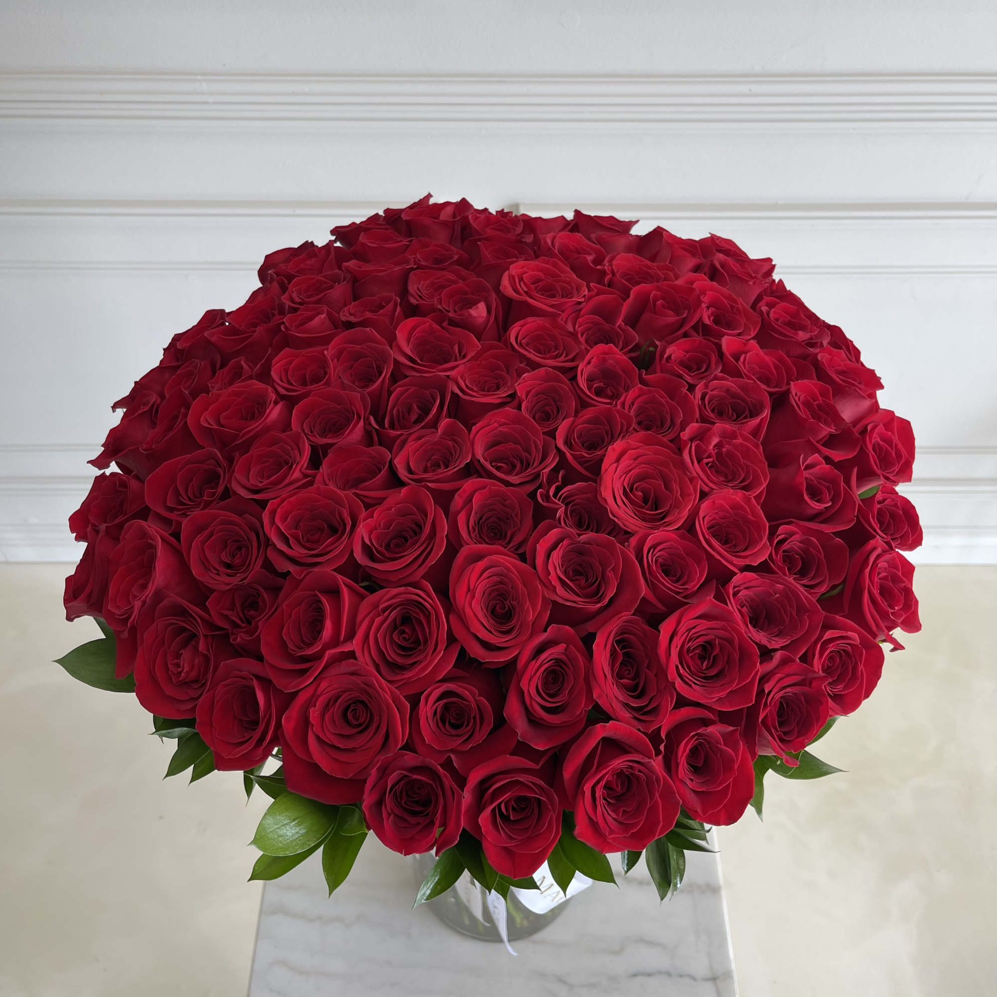 100 Long stem Premium Ecuadorian Roses 
Arranged in a Vase 
Stands approx