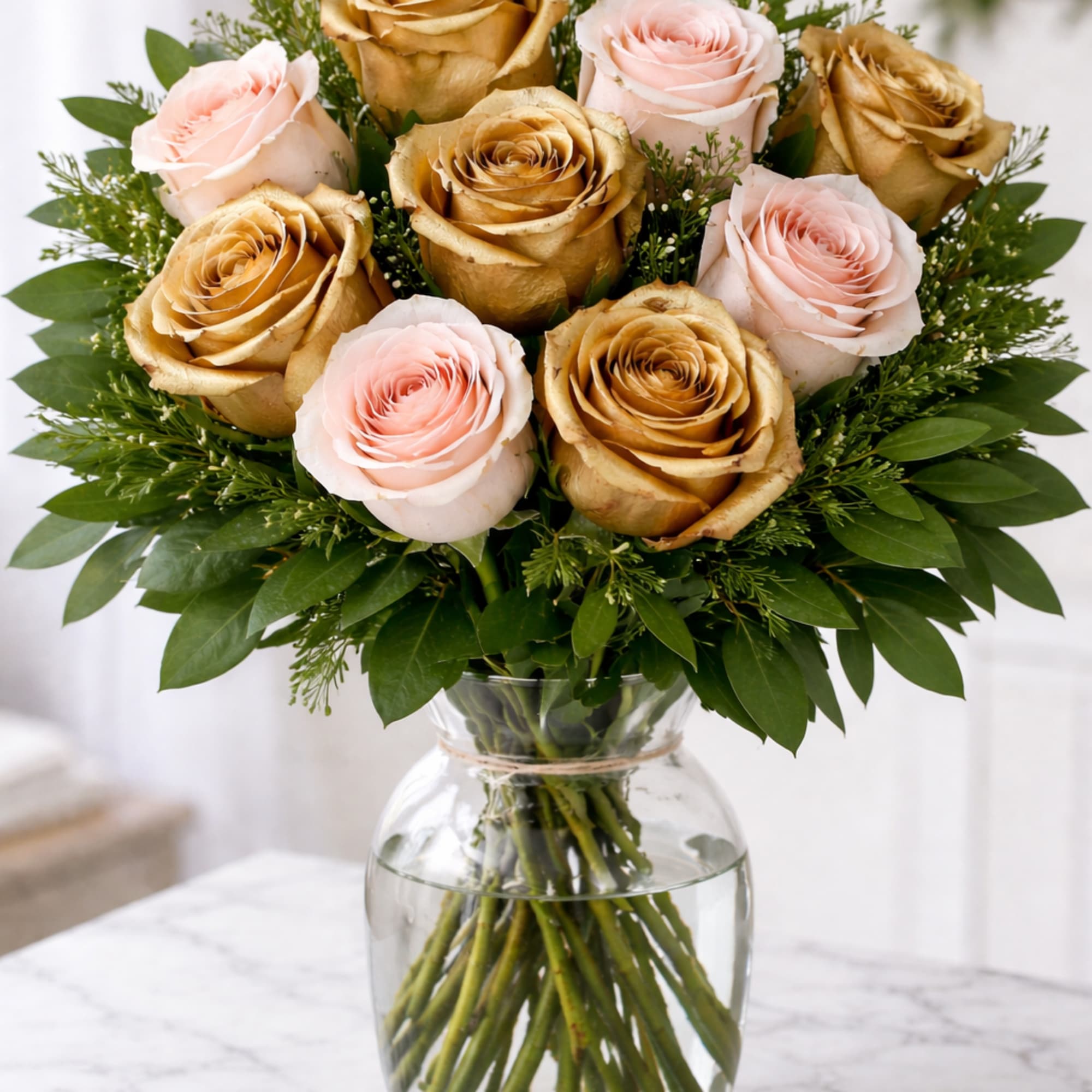6 gold roses and 6 pink roses adorned with bay leaves and