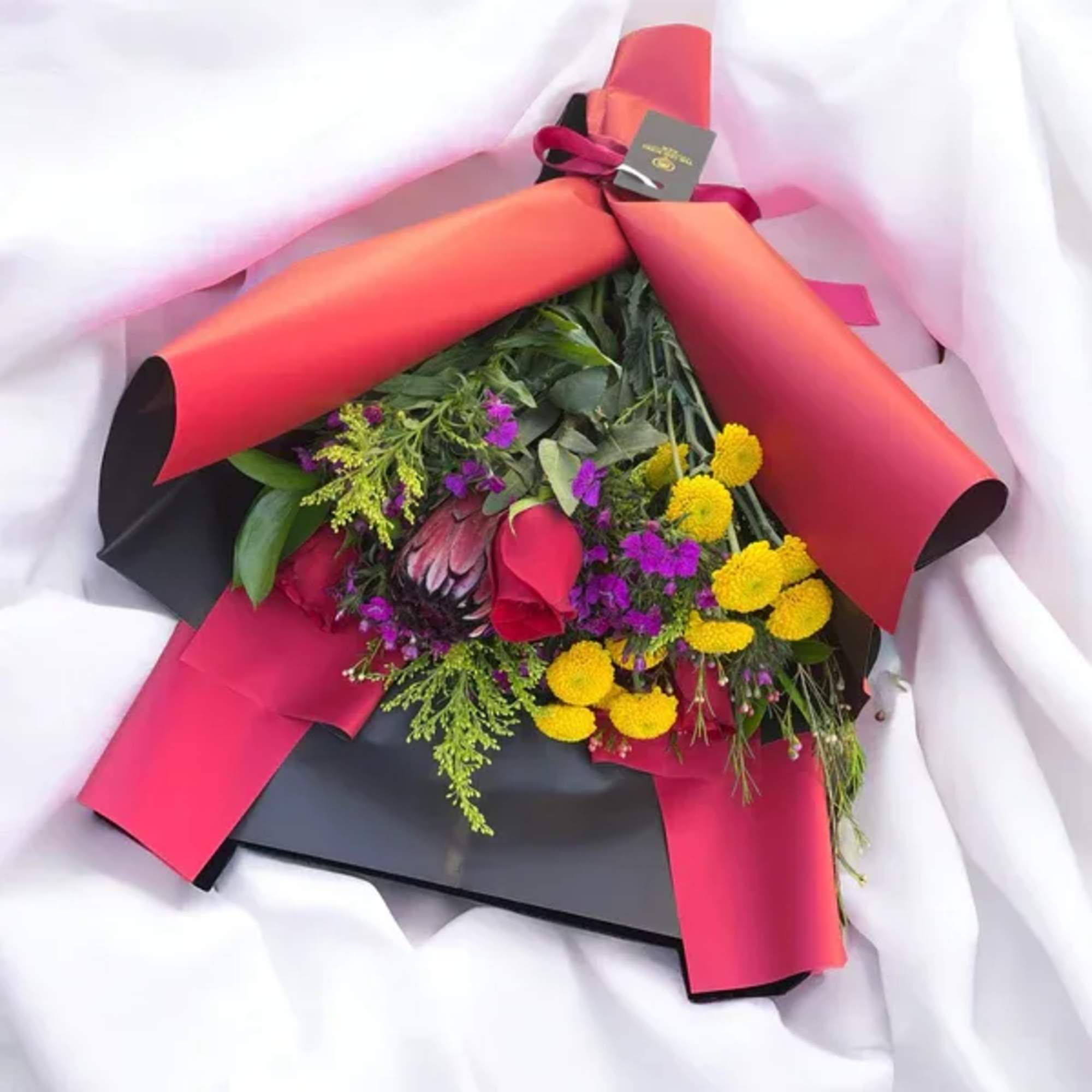 In colorful tones, the custom made Flower Bouquet is every ones favorite!