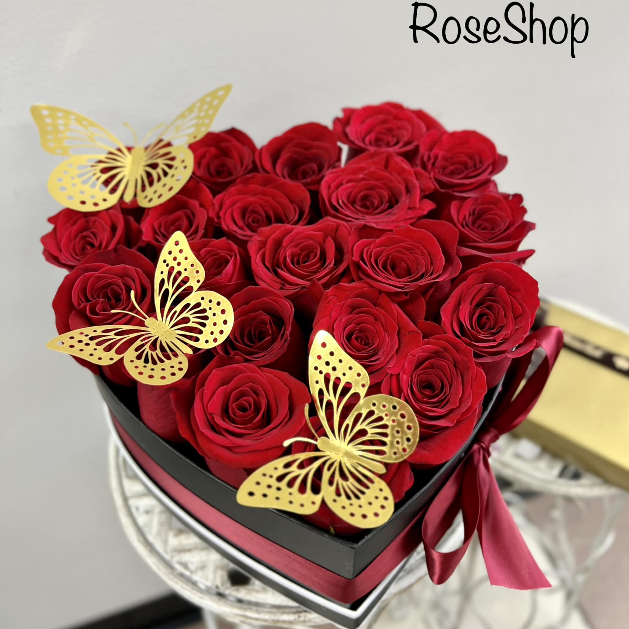 A luxurious heart box with red roses to show your unconditional love.