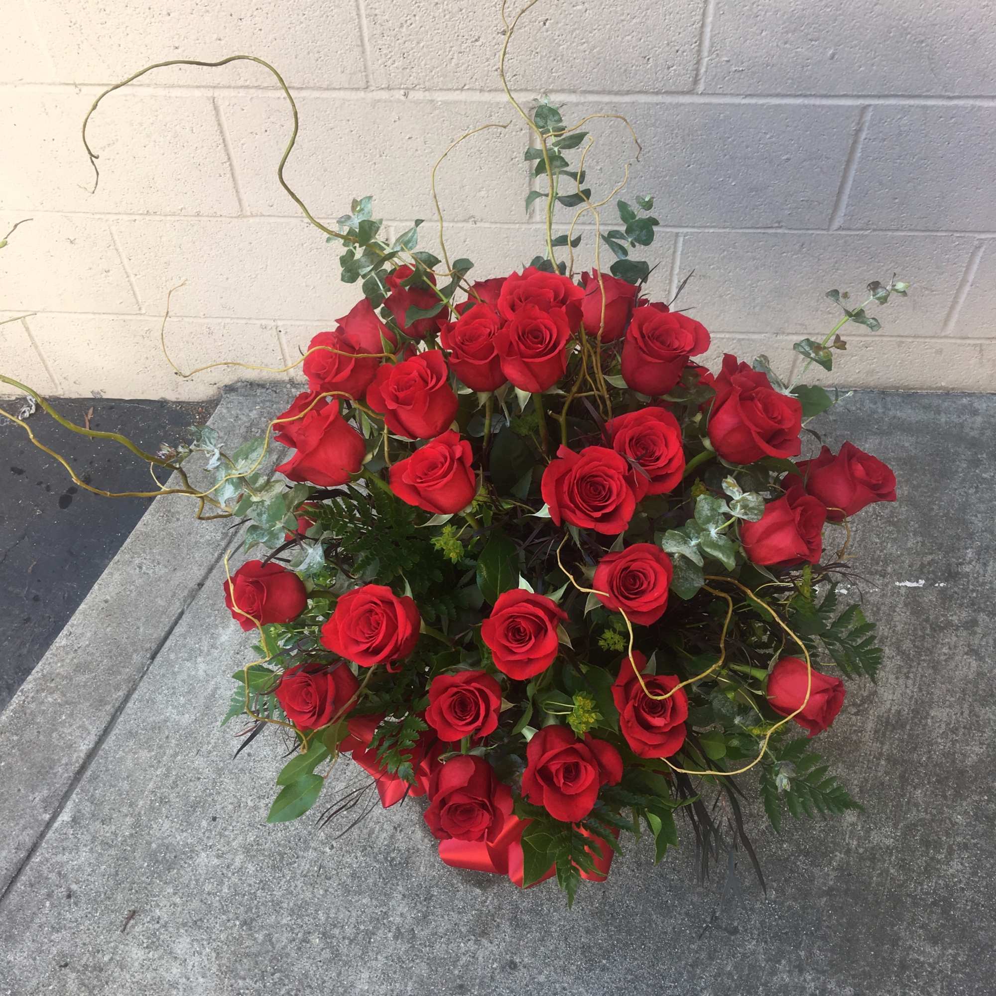 Two dozen beautiful red roses.