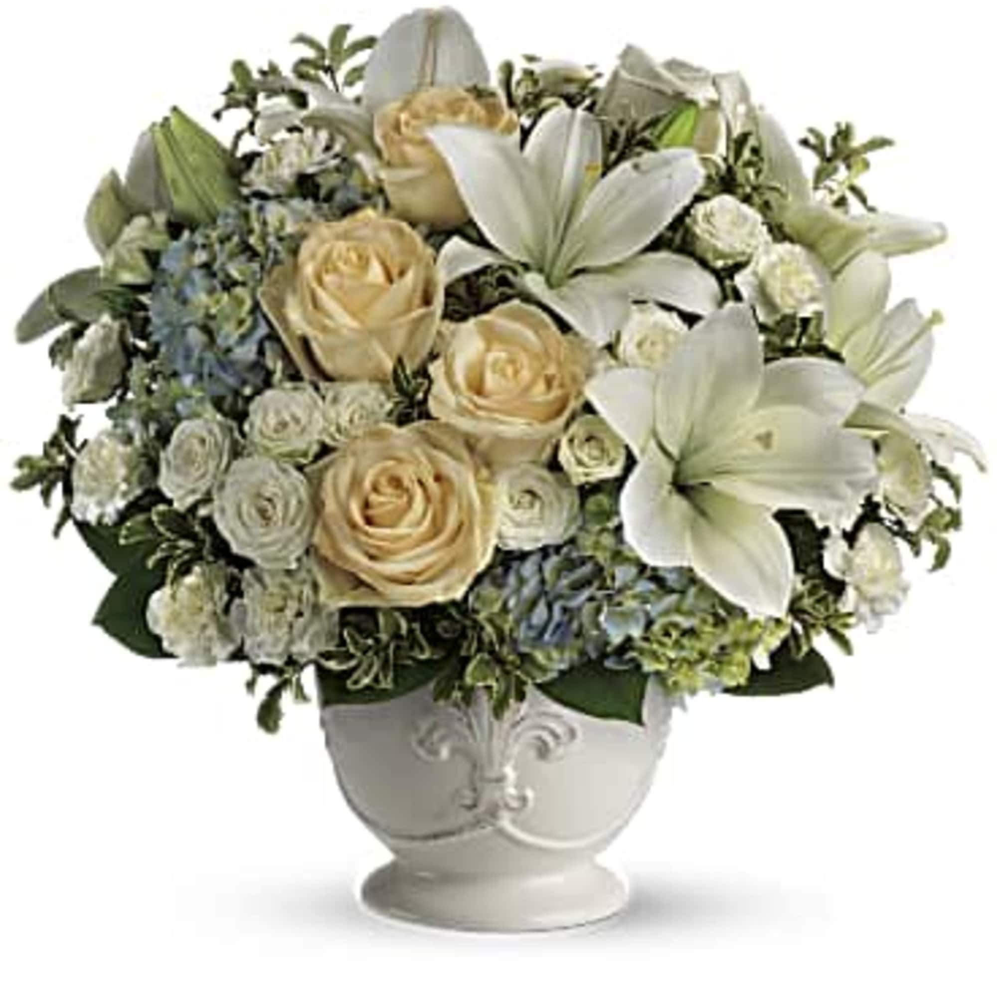 This French country style sympathy arrangement communicates your condolences in a most