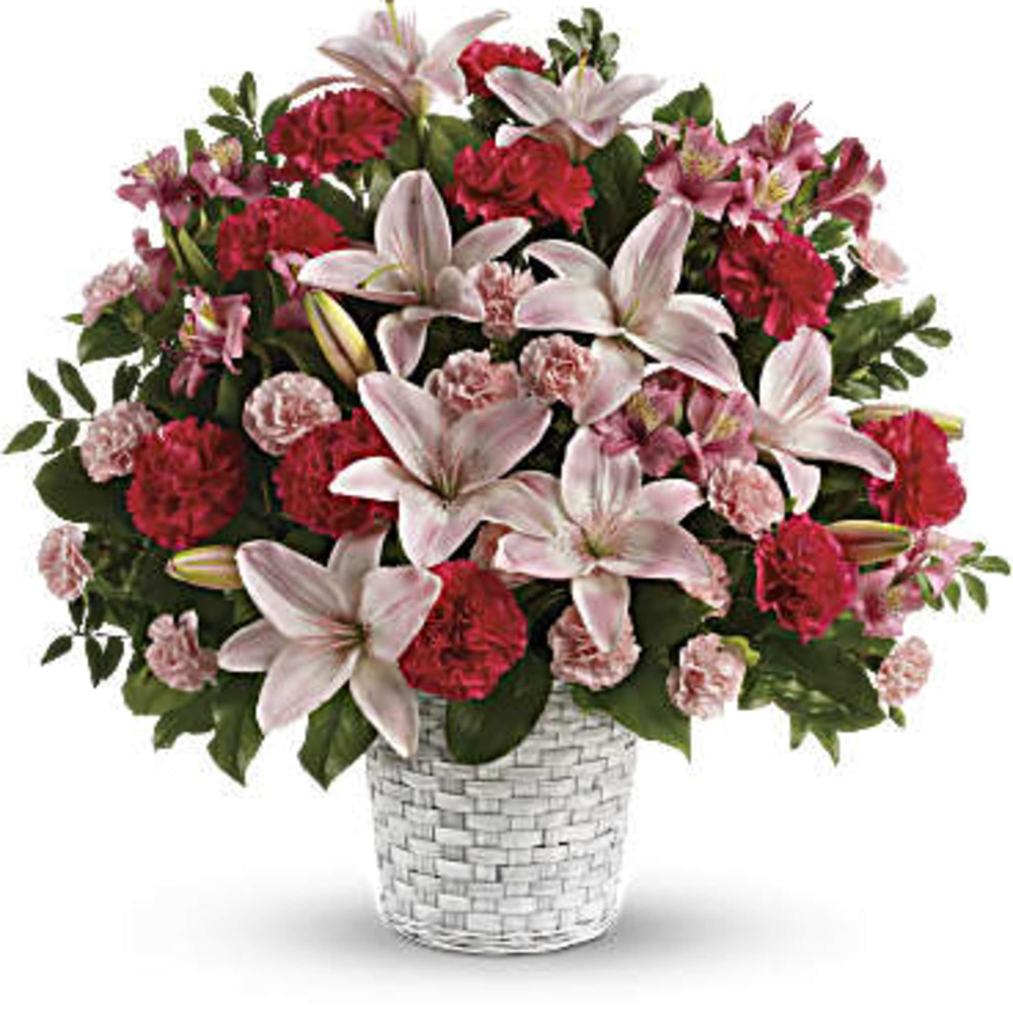 Convey your sympathy tastefully with this lovely gift of pink floral favorites