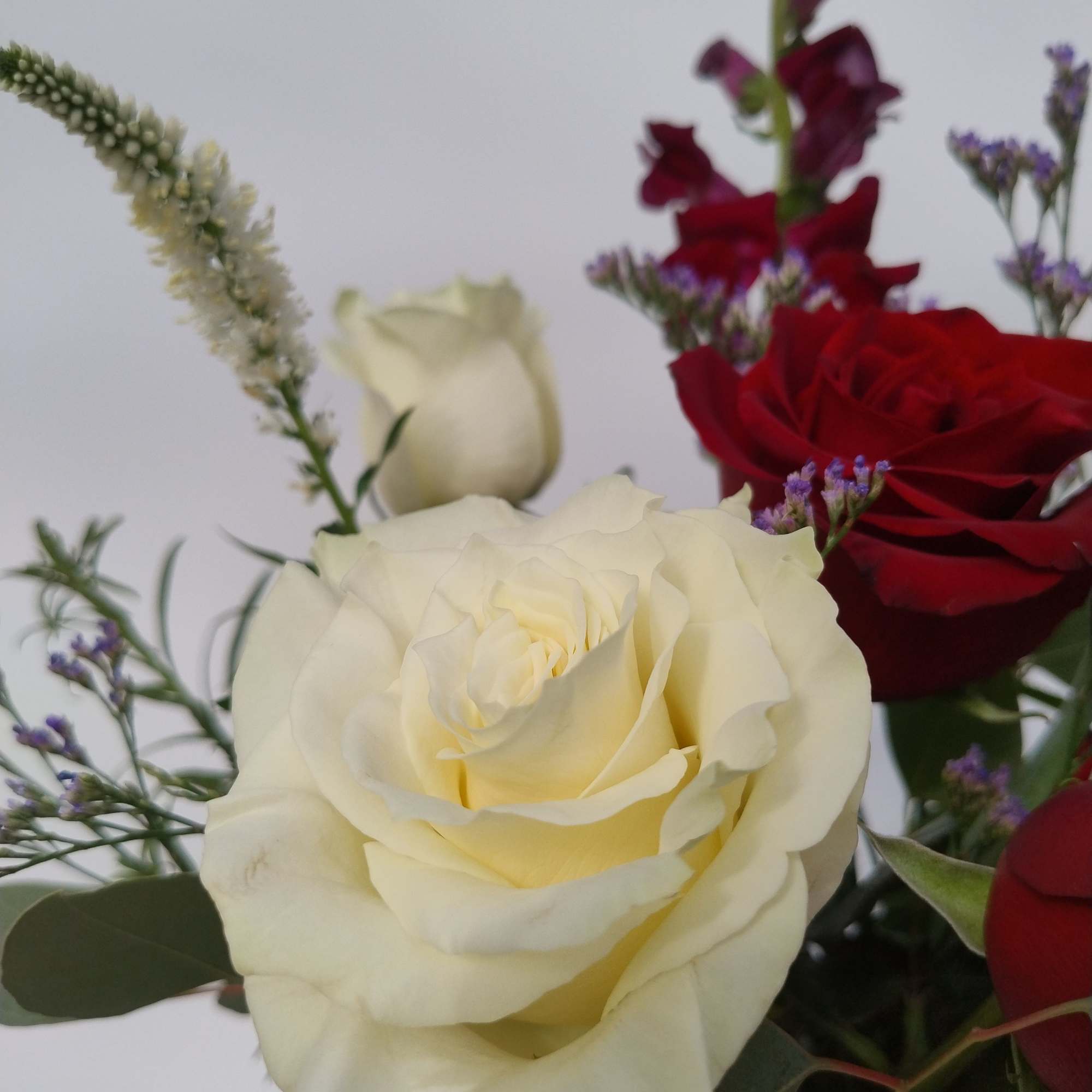 Elegant, clean and traditional. Red and white with greens, arranged in a