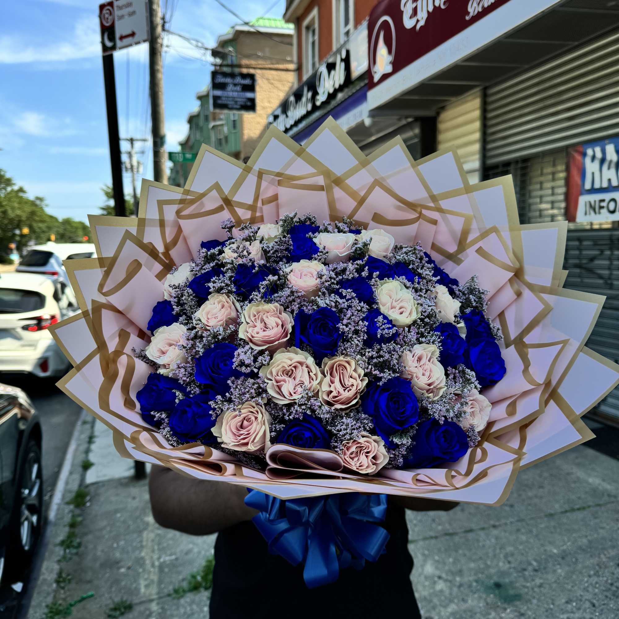 Imagine a bouquet featuring the rare and enchanting combination of blue and
