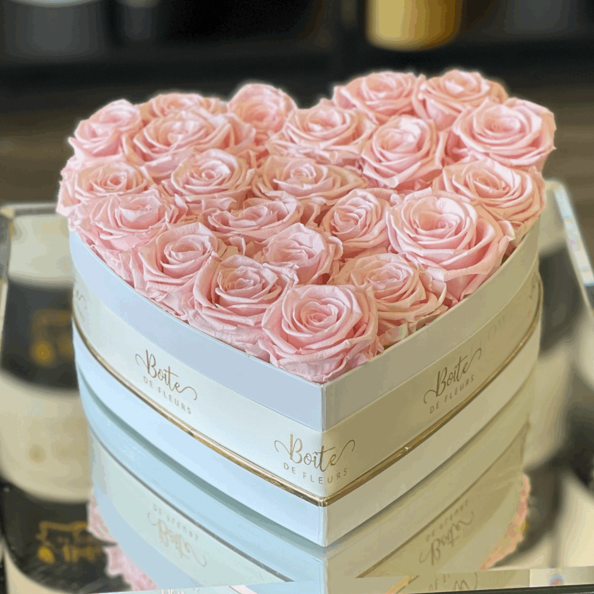 Forever roses nestle in our Signature Bo&icirc;te in the shape of a