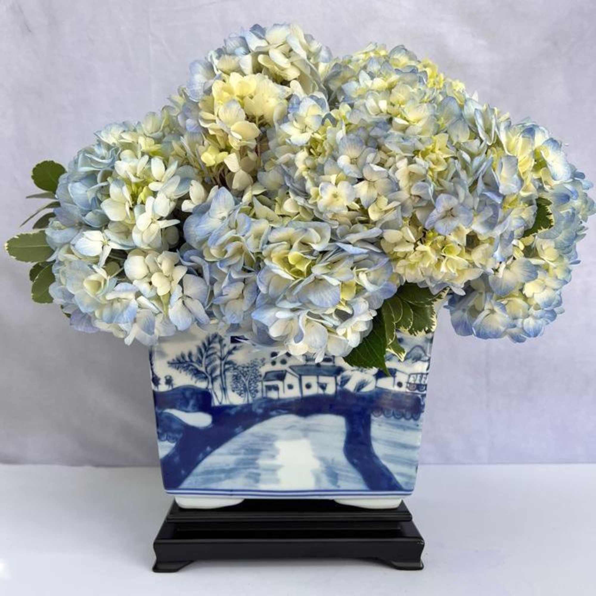 Reproduction Blue and White Cachepot with display base filled with Blue Hydrangeas