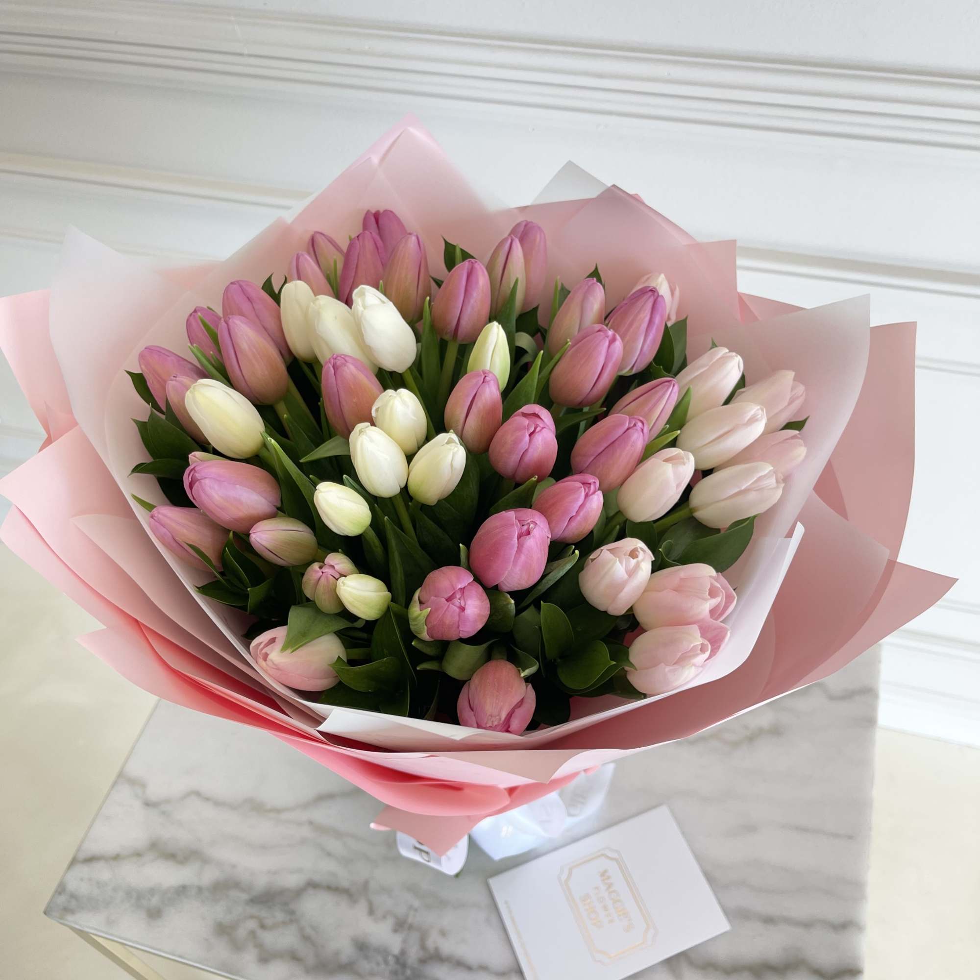50 Tulips wrapped in craft paper

*This bouquet does not include a glass