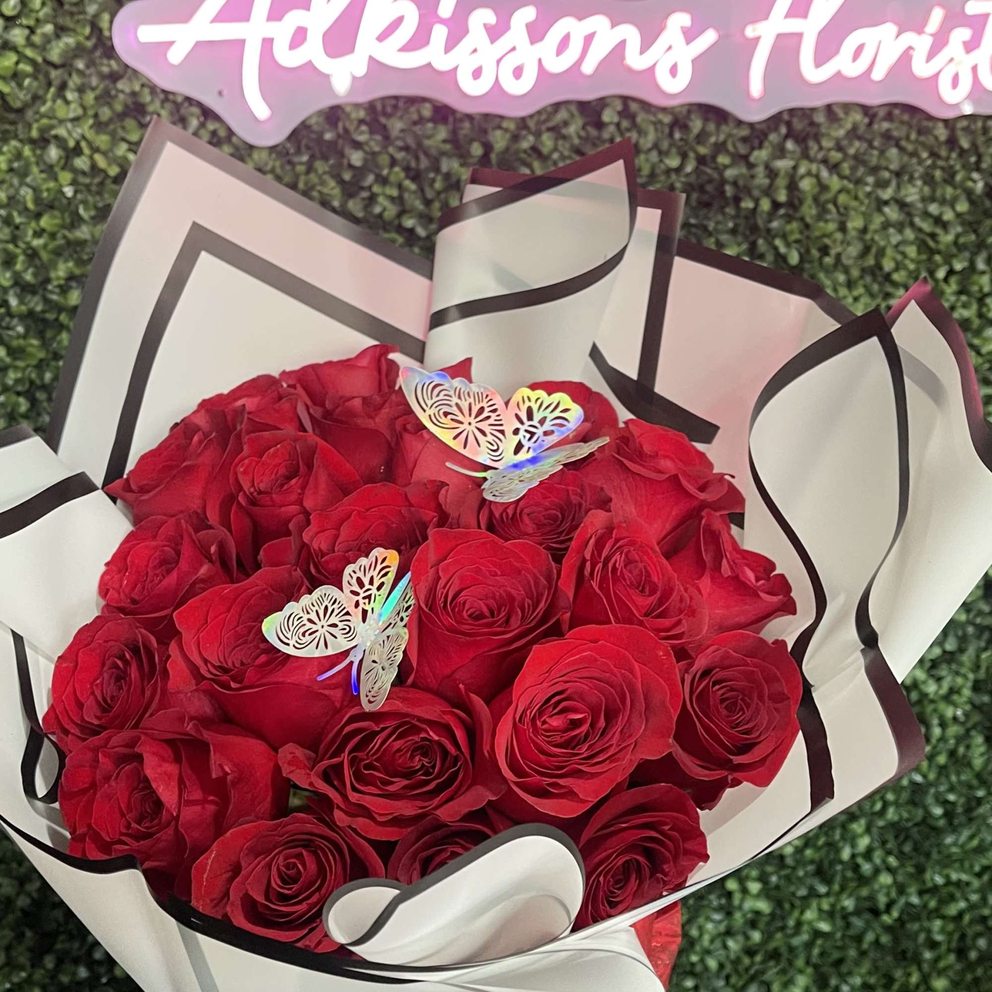 Red roses wrapped in paper. 

* (Not Included) Butterflies are additional 
*