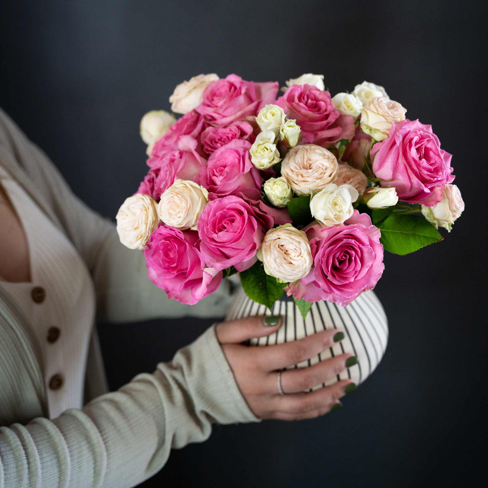 Delight in the beauty of soft pink roses and garden spray roses