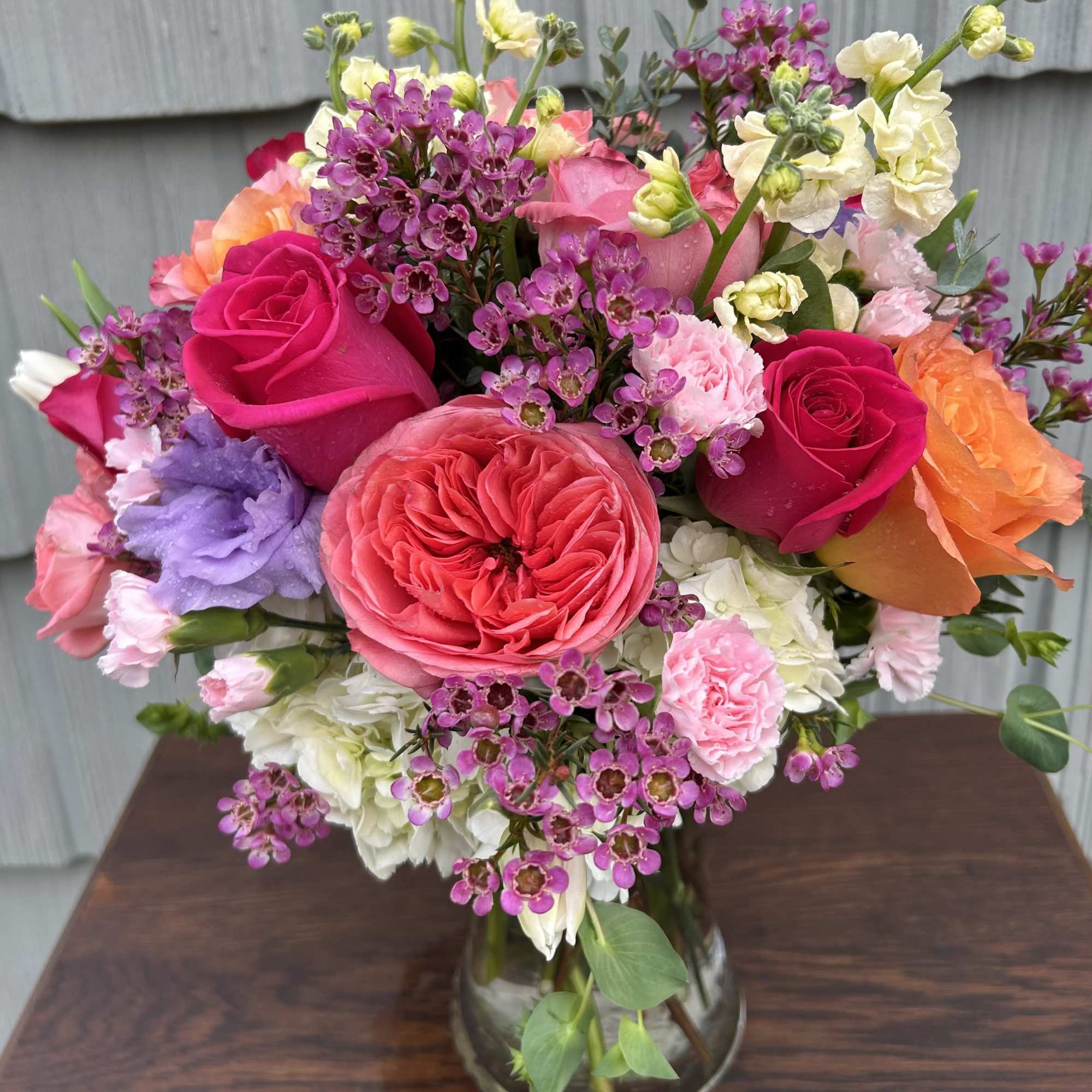 A beautiful assortment of garden roses, tulips, stock and spray roses with
