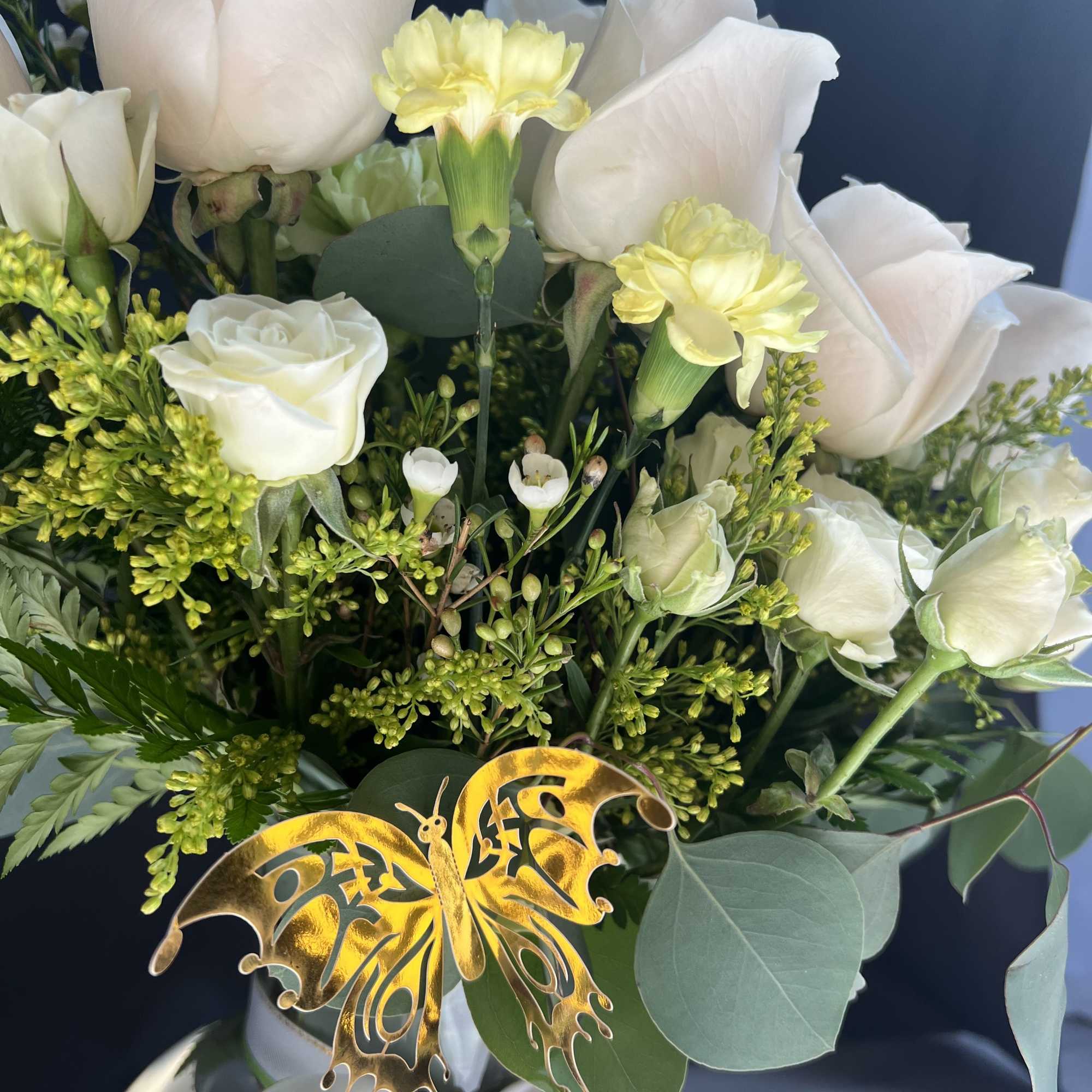 An off white rose and yellow filler flowers  is a great