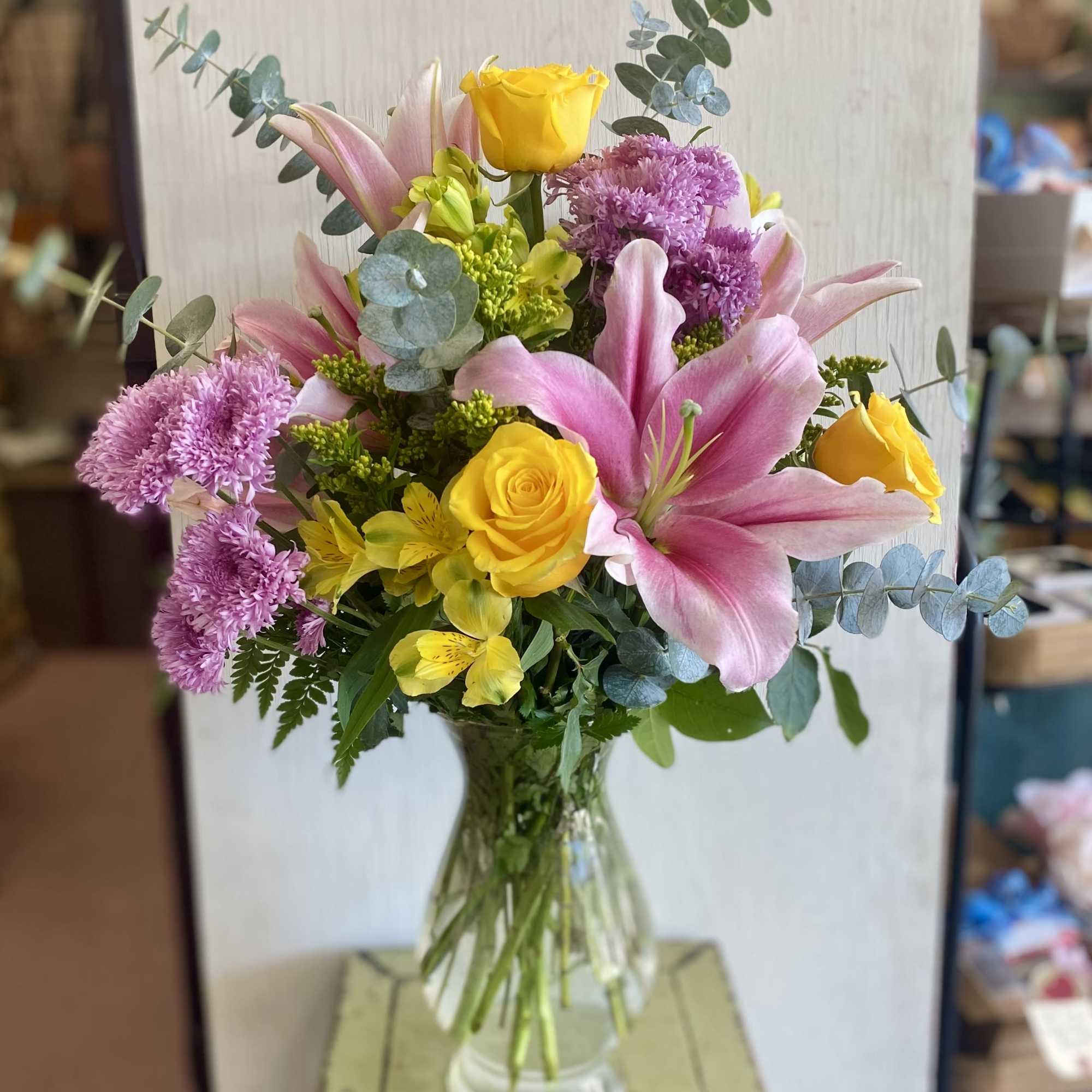 So beautiful! Lilies and roses galore.  A large, impressive vase arrangement.
Approx