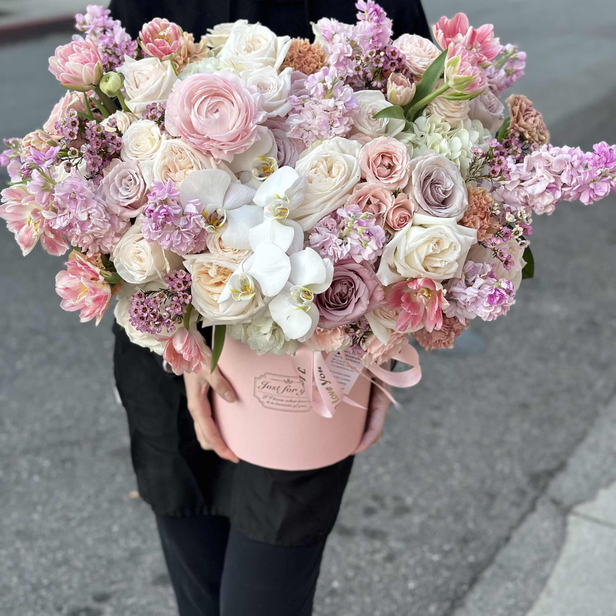 A dreamy blend of soft pink and pastel blooms, thoughtfully arranged in