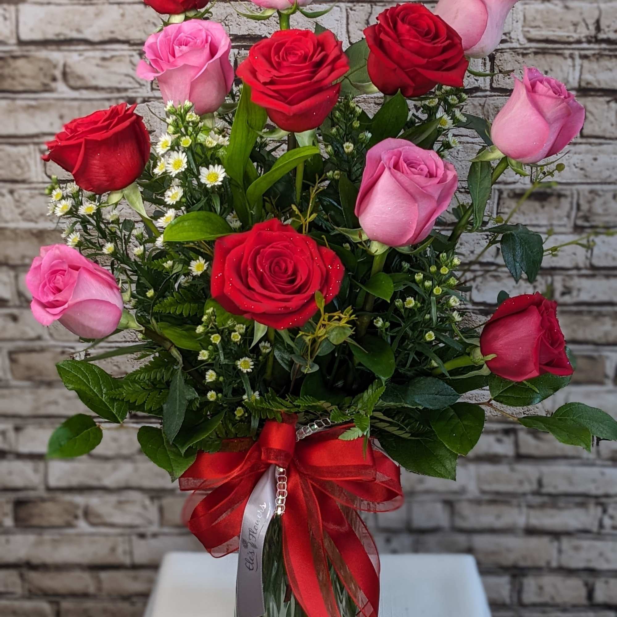 Indulge in classic beauty with our Passionate Roses arrangement, featuring one dozen