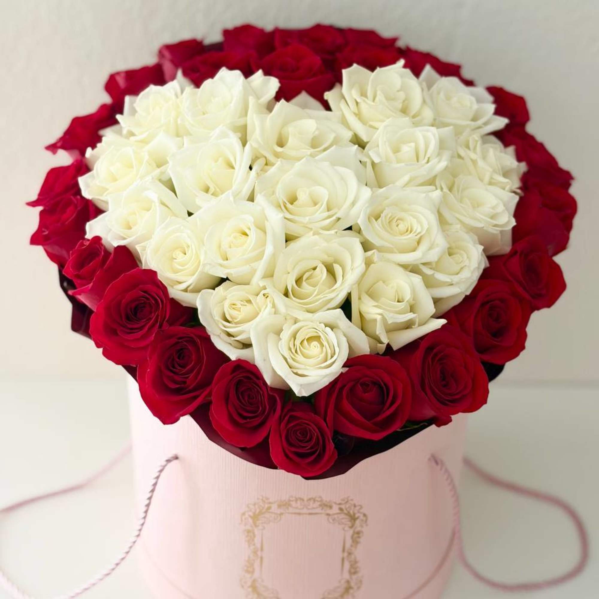 A refined and elegant hat box arrangement featuring 42 premium red and