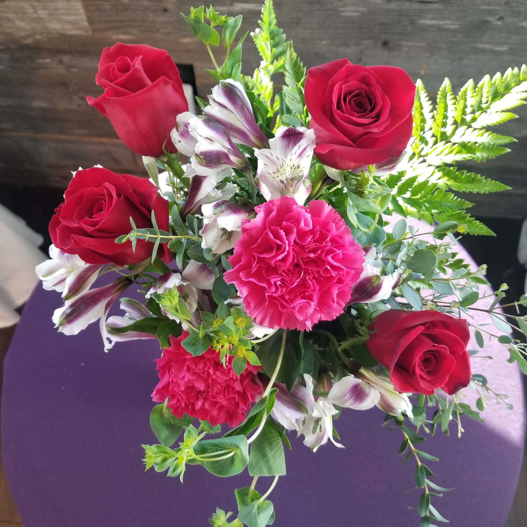   Roses, alstroemeria, and carnations  with trendy greenery.  

We