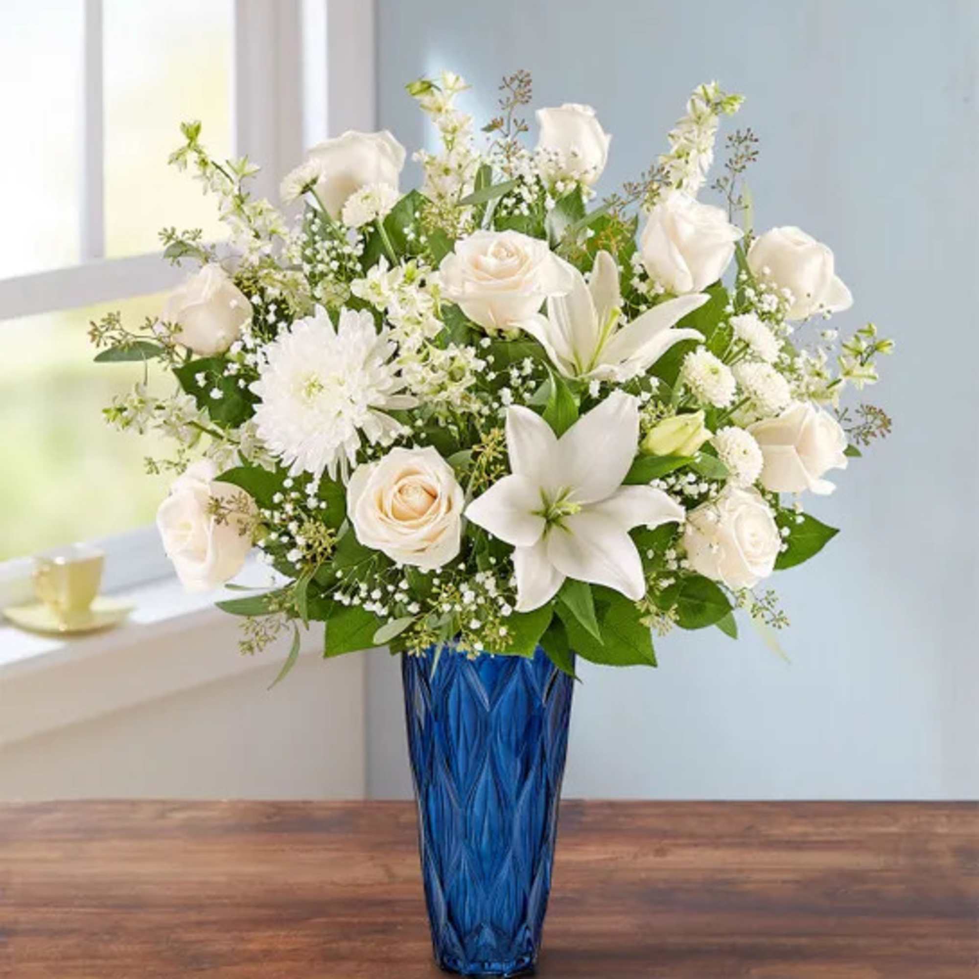 A beautiful tribute to someone so loved. Our abundant arrangement is filled