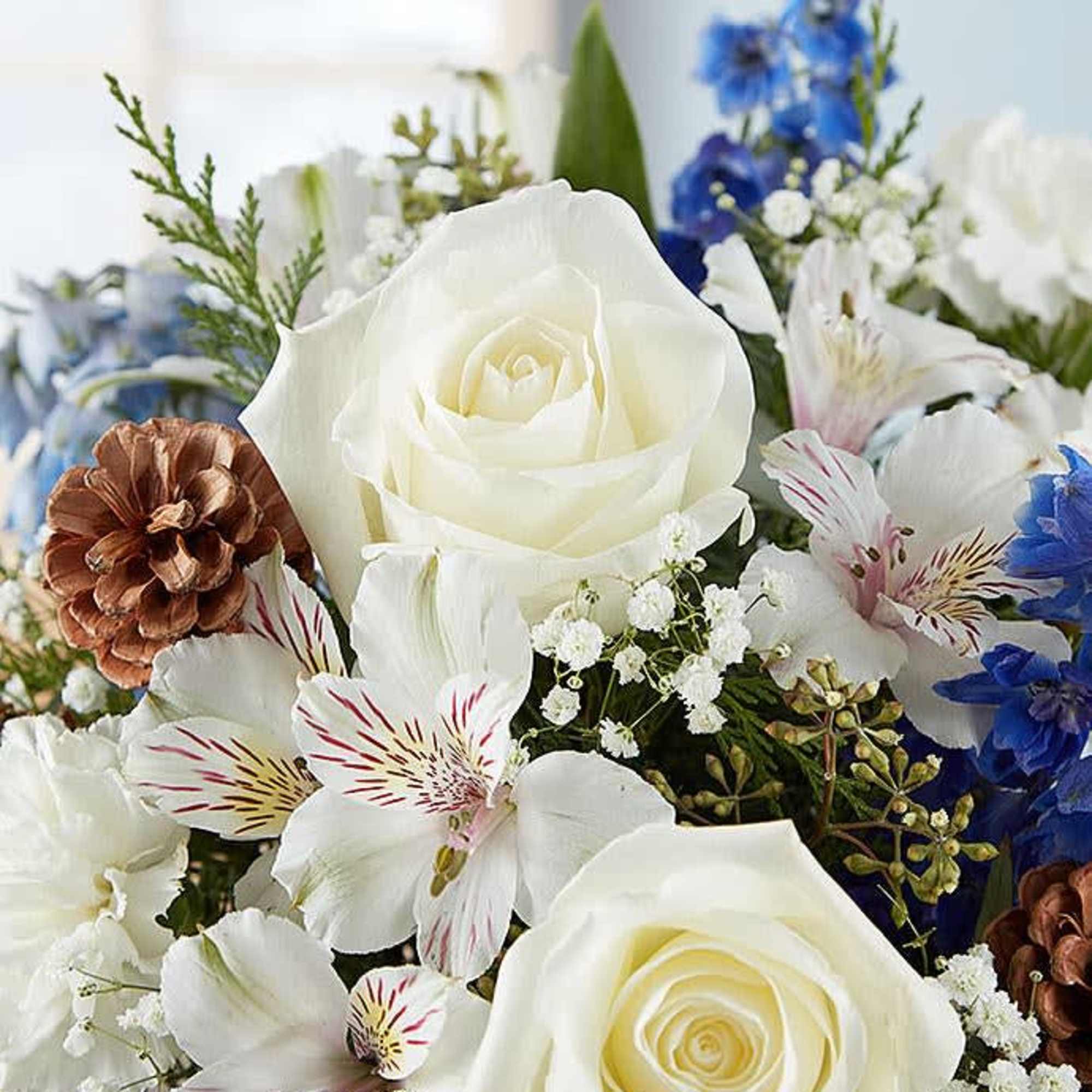 Inspired by winter&rsquo;s cool white &amp; blue landscape, our delightful arrangement delivers