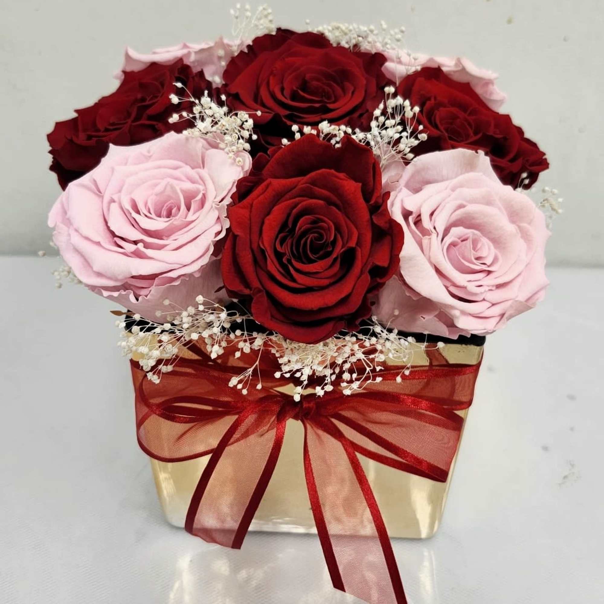 9 Beautiful "Preserved" Roses in shades of pink and red, with a