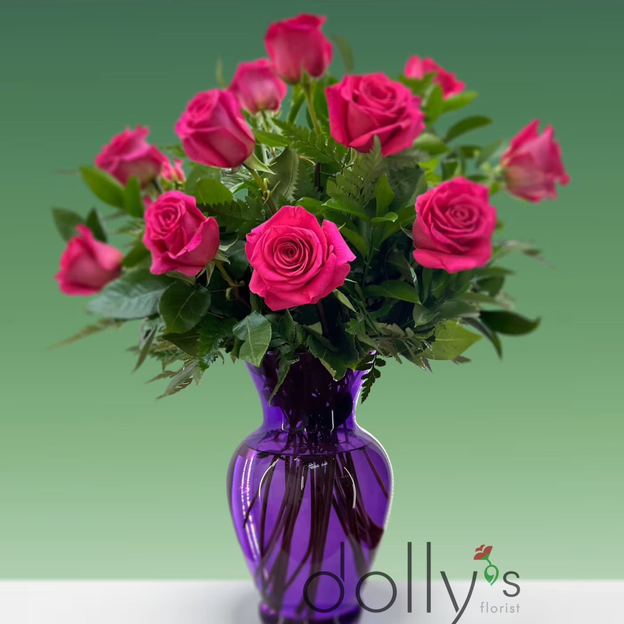 Surprise someone with these Hot Pink Roses arranged in a vase.