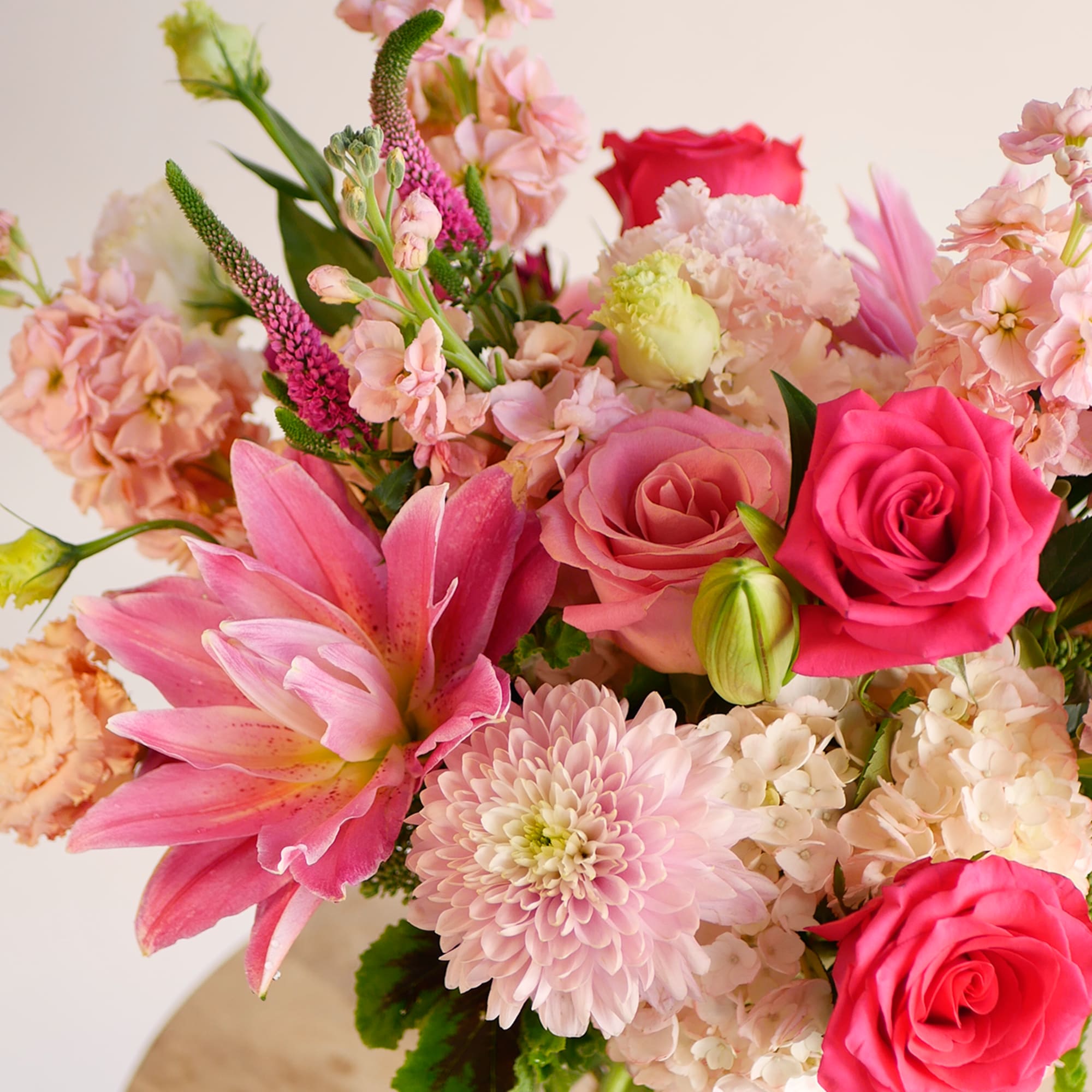 Radiating romance and charm, this vibrant arrangement features a lush blend of