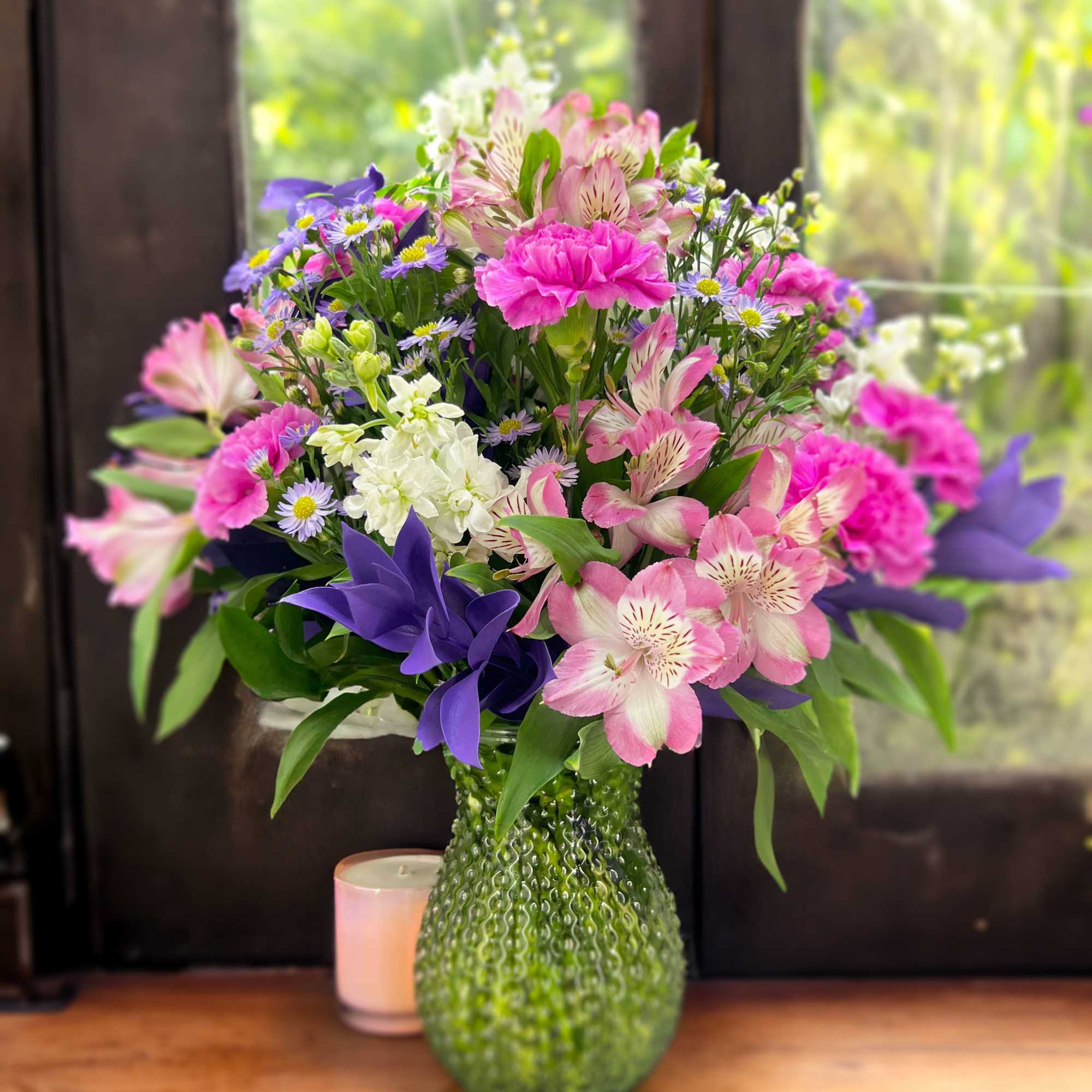 This bouquet will surprise with its' size! Composed of alstroemeria, dianthus, and
