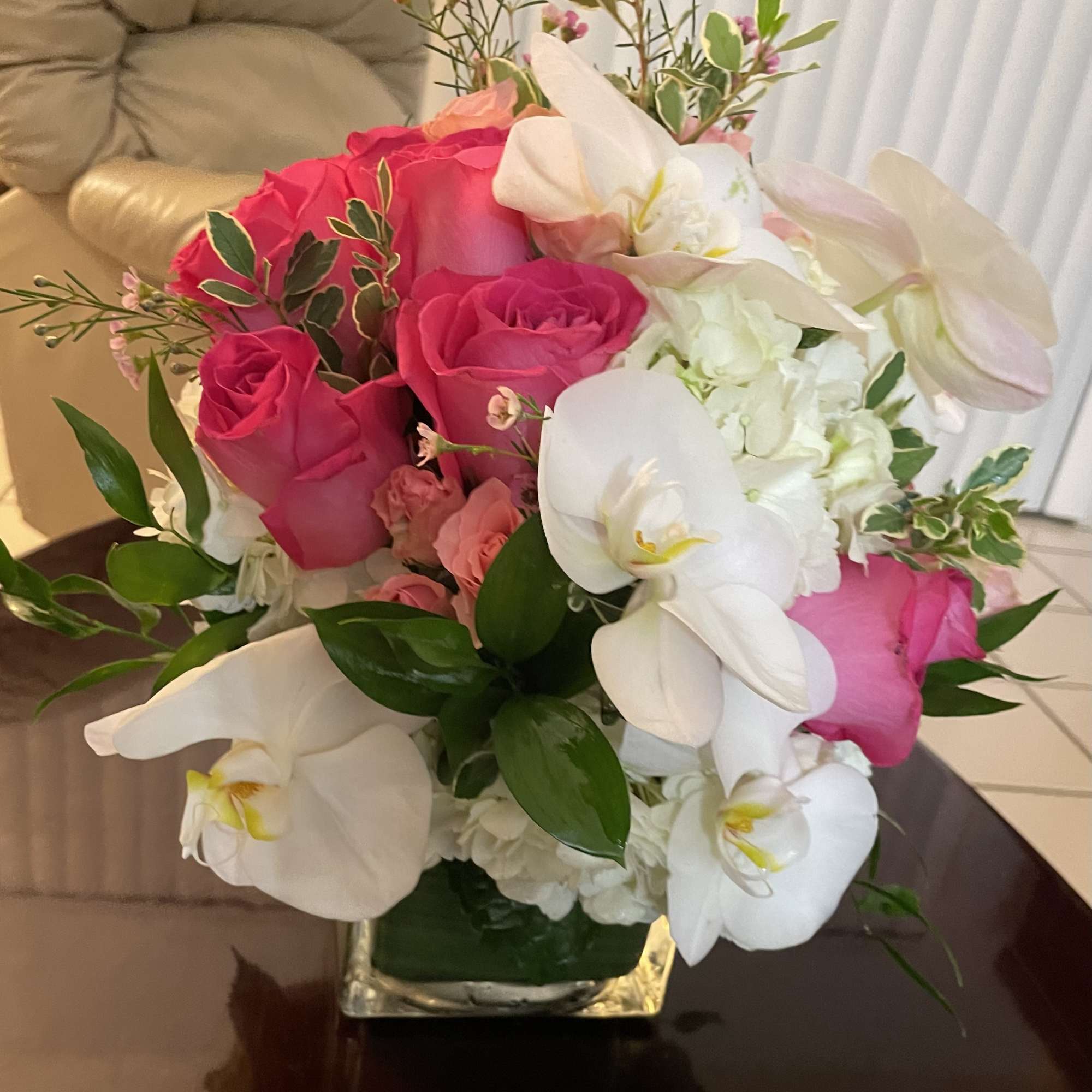 Classic and Beautiful, this large arrangement whispers luxury. Soft pinks, whites and
