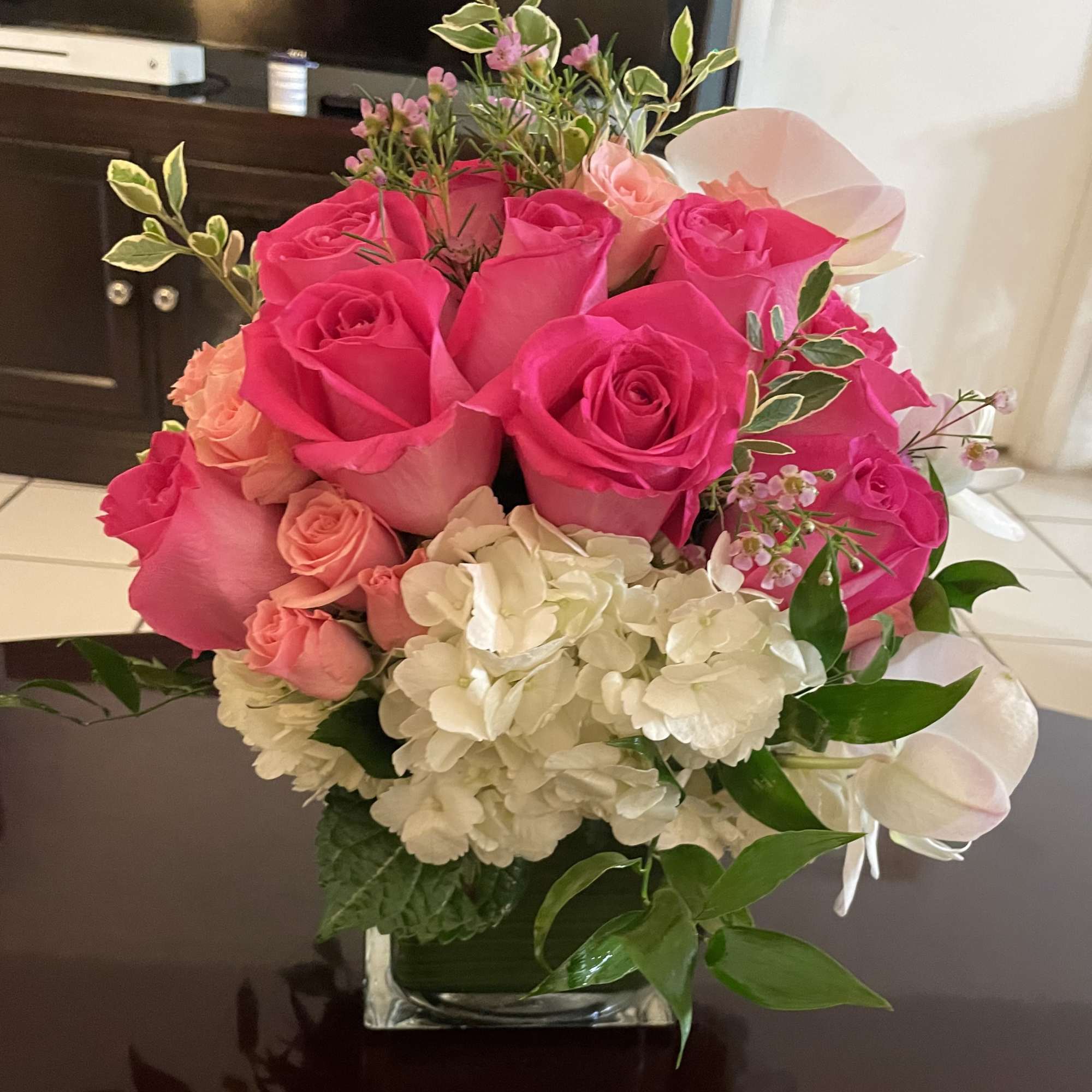 Classic and Beautiful, this large arrangement whispers luxury. Soft pinks, whites and