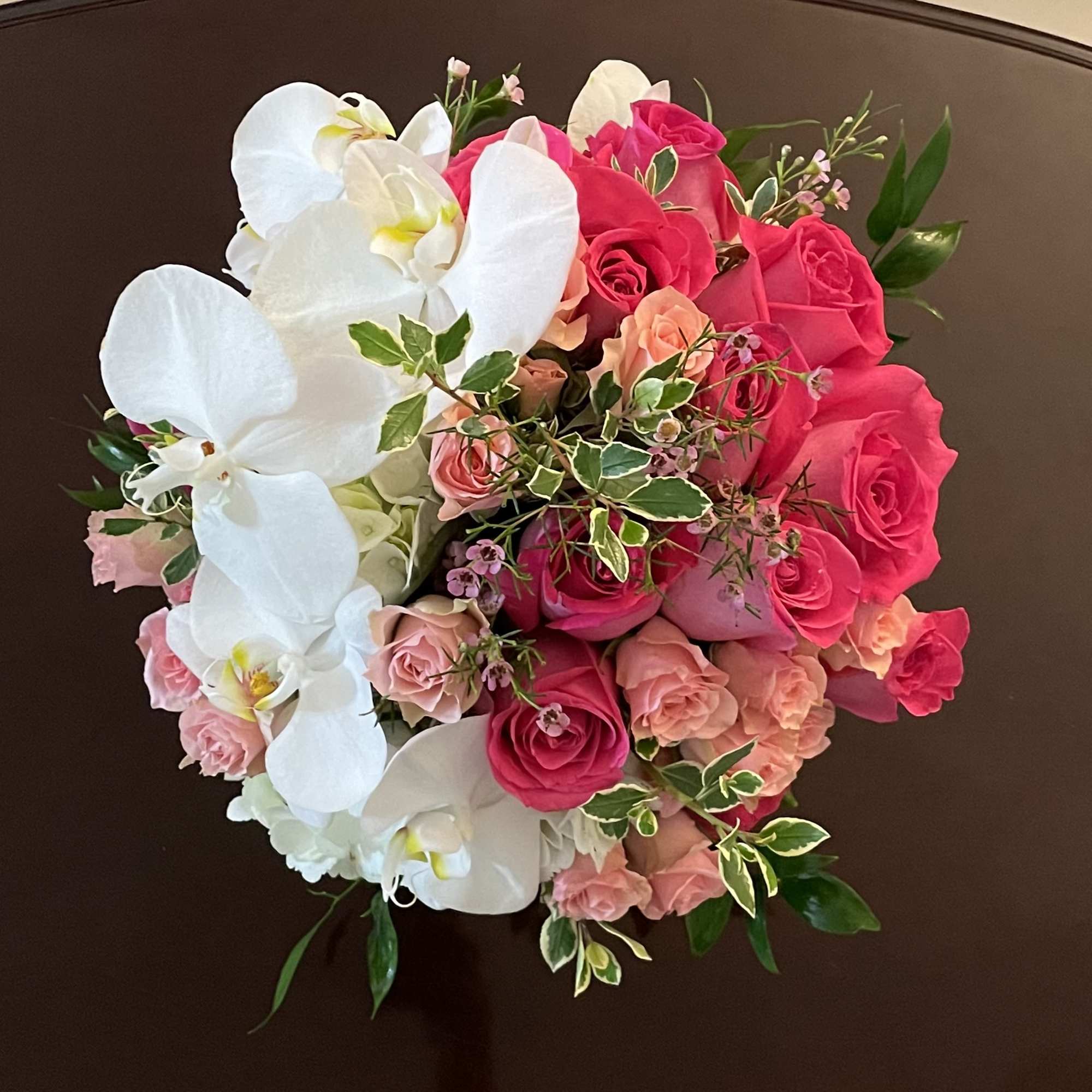 Classic and Beautiful, this large arrangement whispers luxury. Soft pinks, whites and