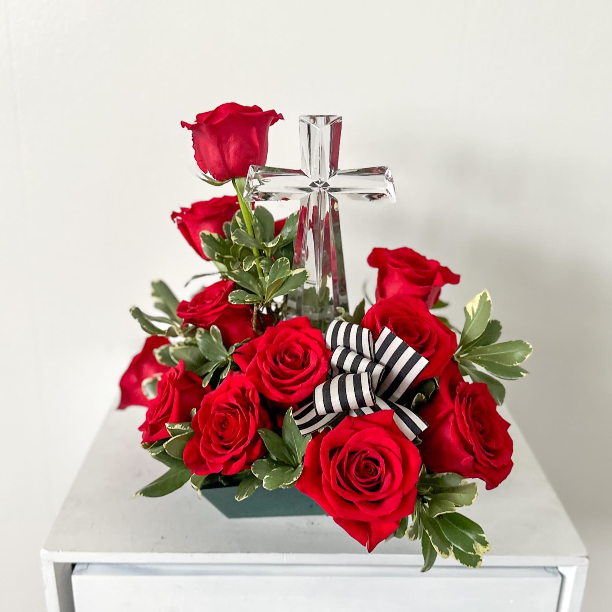 This crystal cross is a nice sympathy keepsake. It is surrounded by