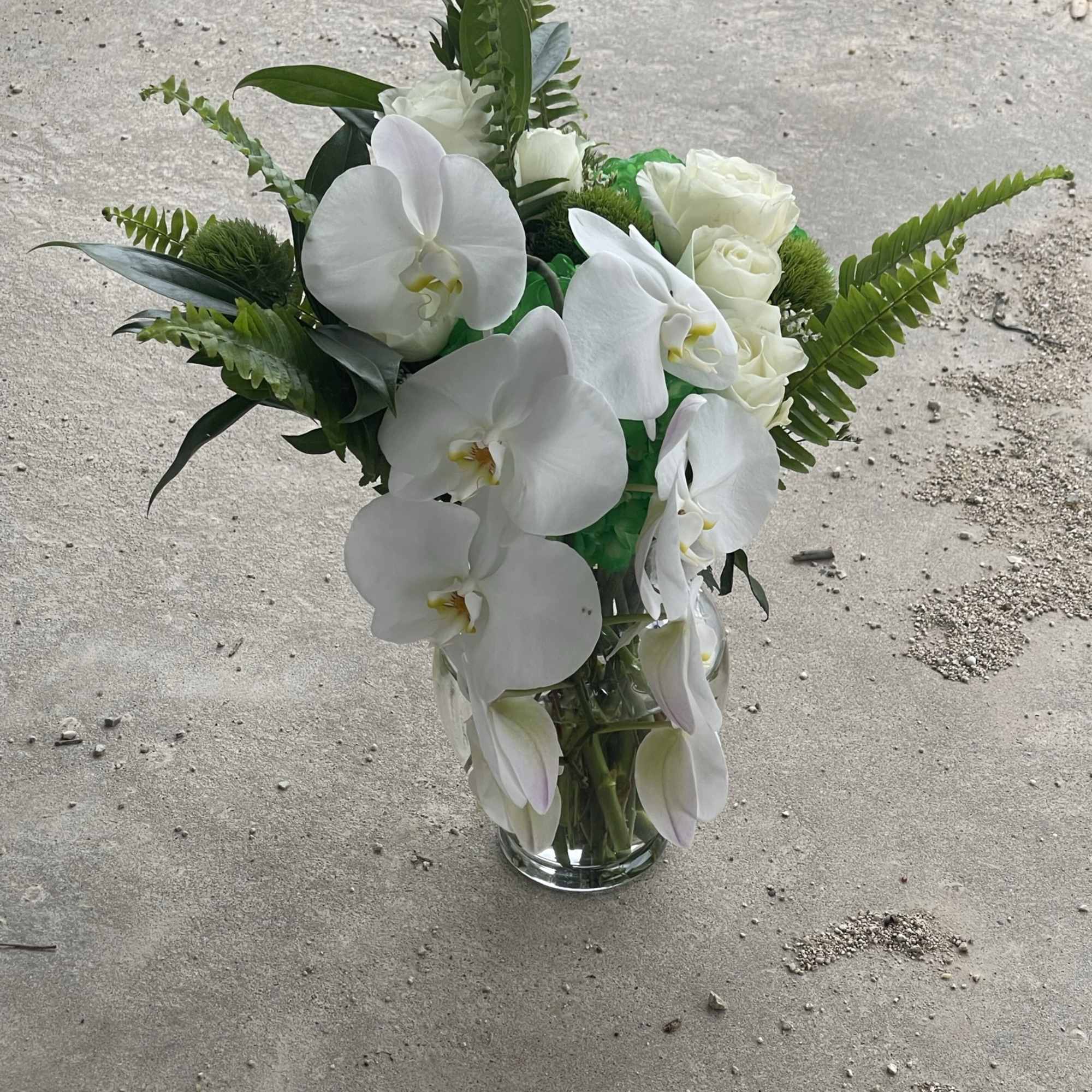 Enter a world of greens and blissful white orchids with this custom