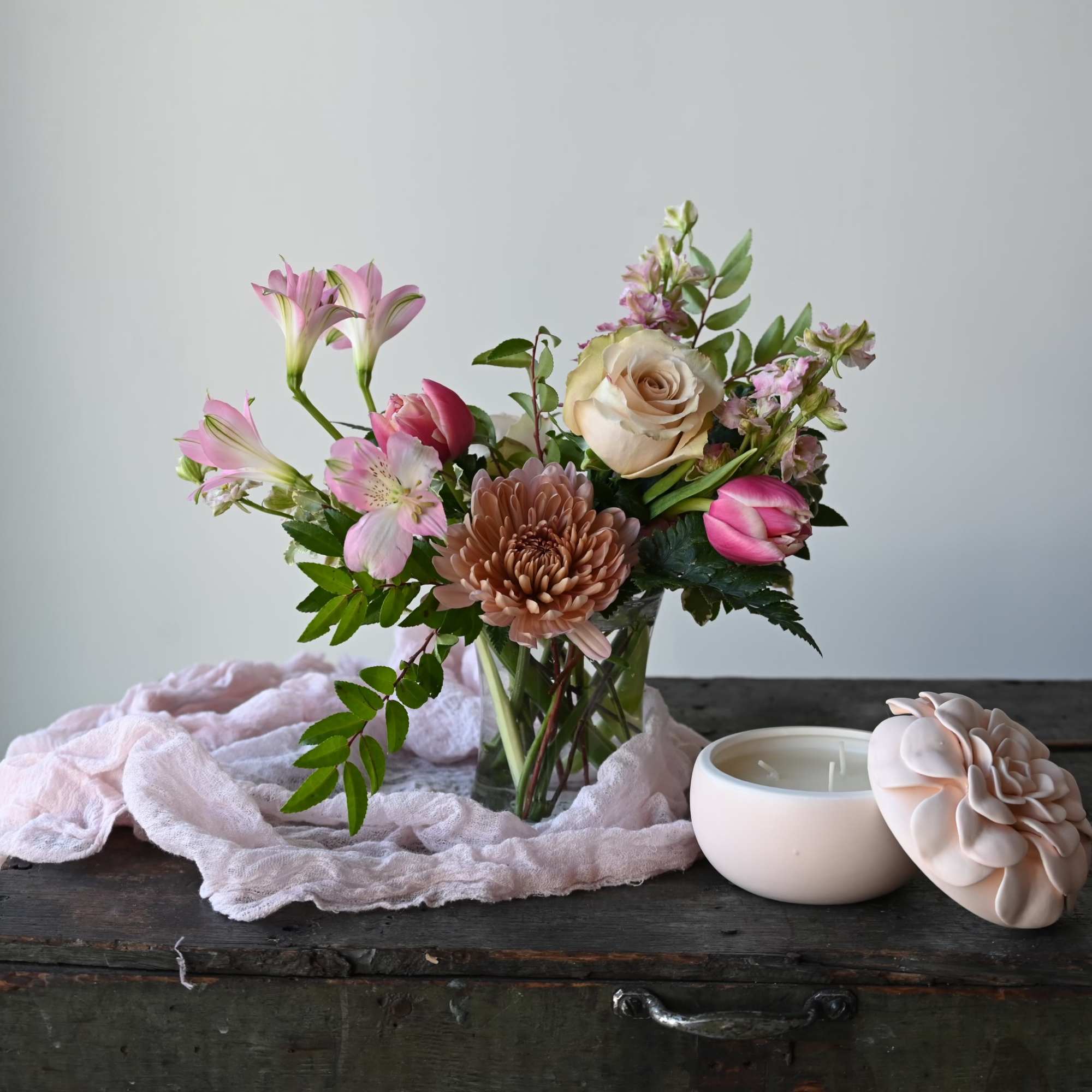 Our mason jar holds a simple, but lovely bouquet of seasonal flowers.