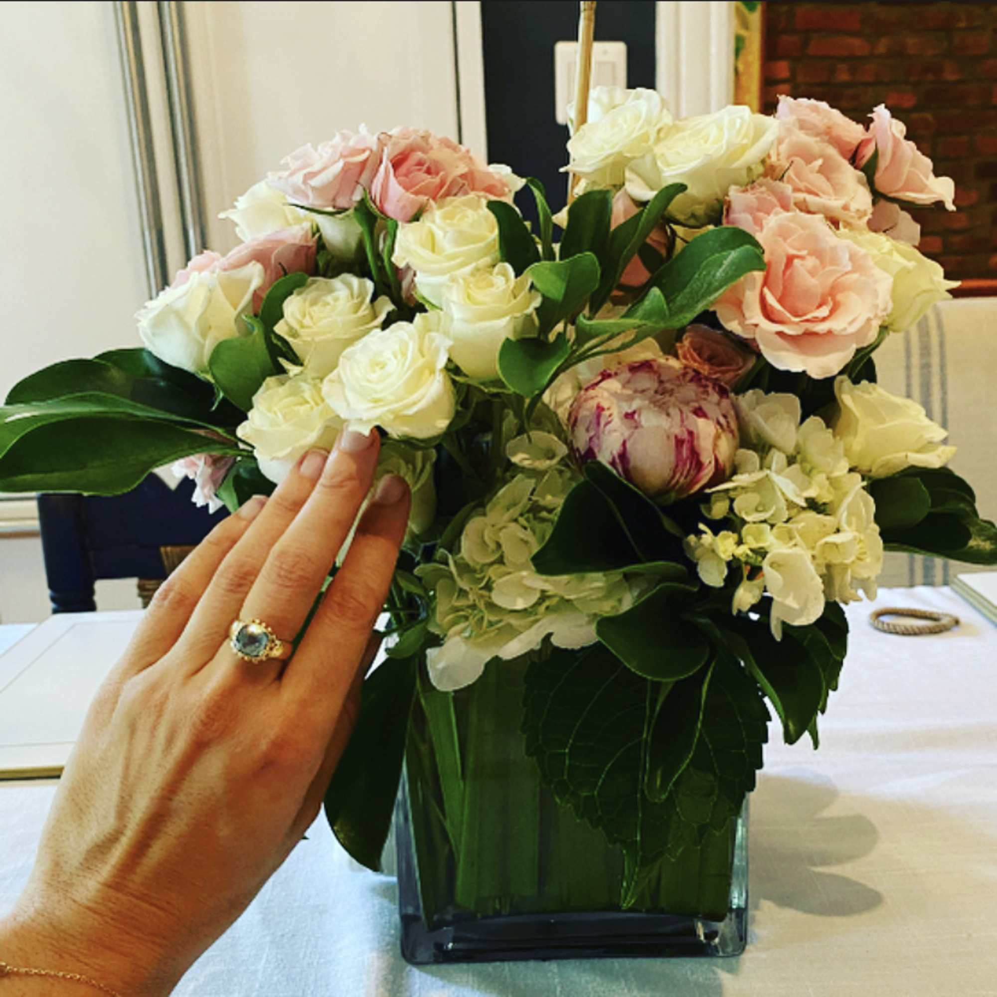 Pretty little bouquet. Hydrangea, spray roses. Pictured in light Pink and White.