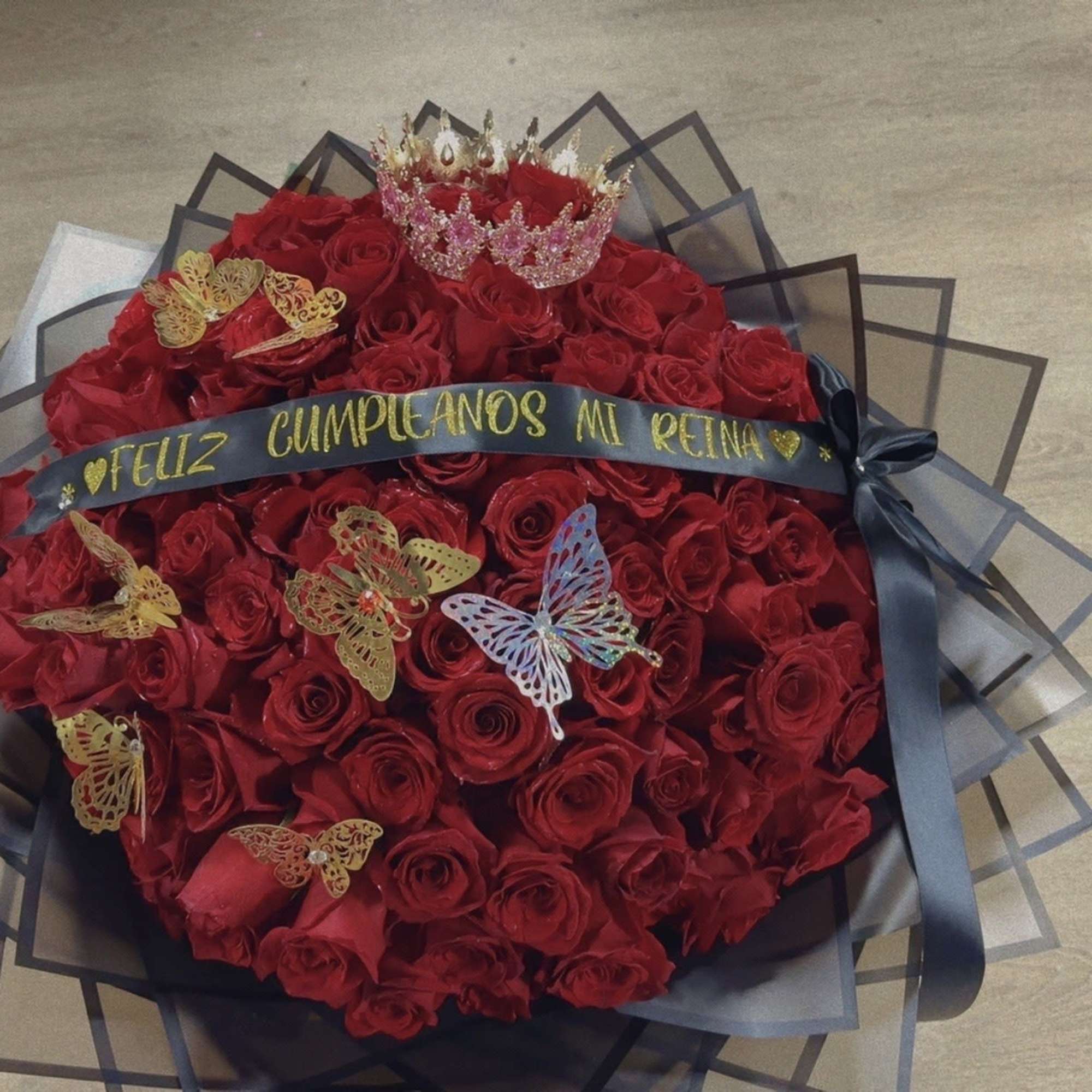 this is our Classic Ramo Buchon, containing classical Red Roses with Baby's