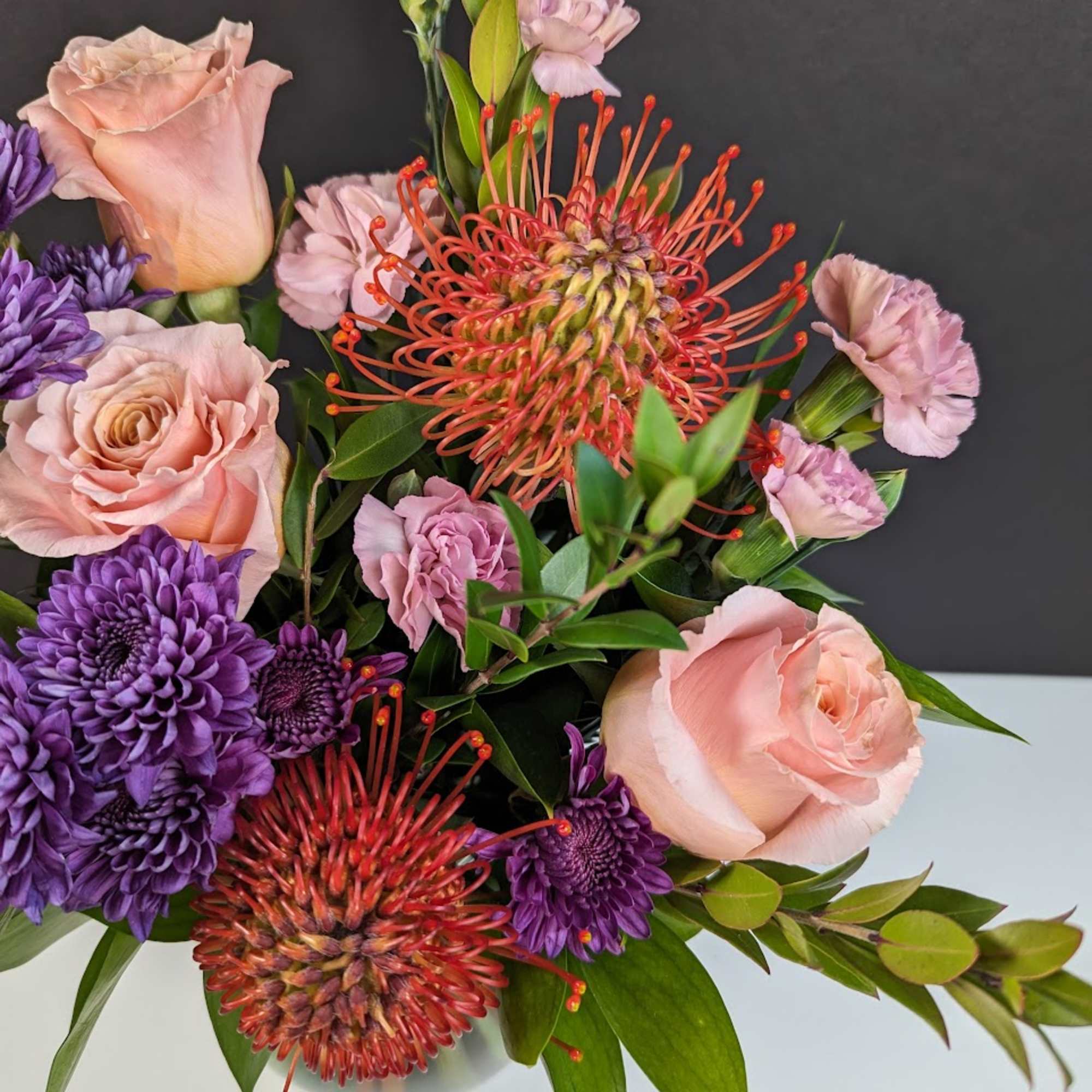 Experience Serene Luxury with the Sunset Bliss Floral Arrangement

Elevate your space with