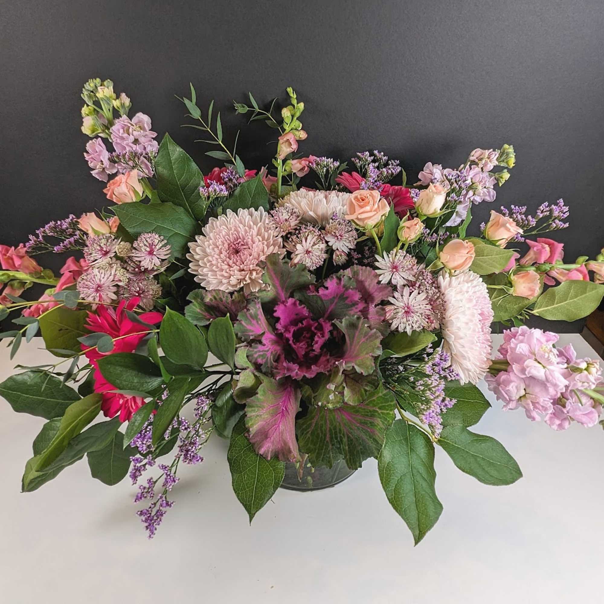 Surprise Someone Special with Our Twilight Blossoms Arrangement

This twilight of blossoms is