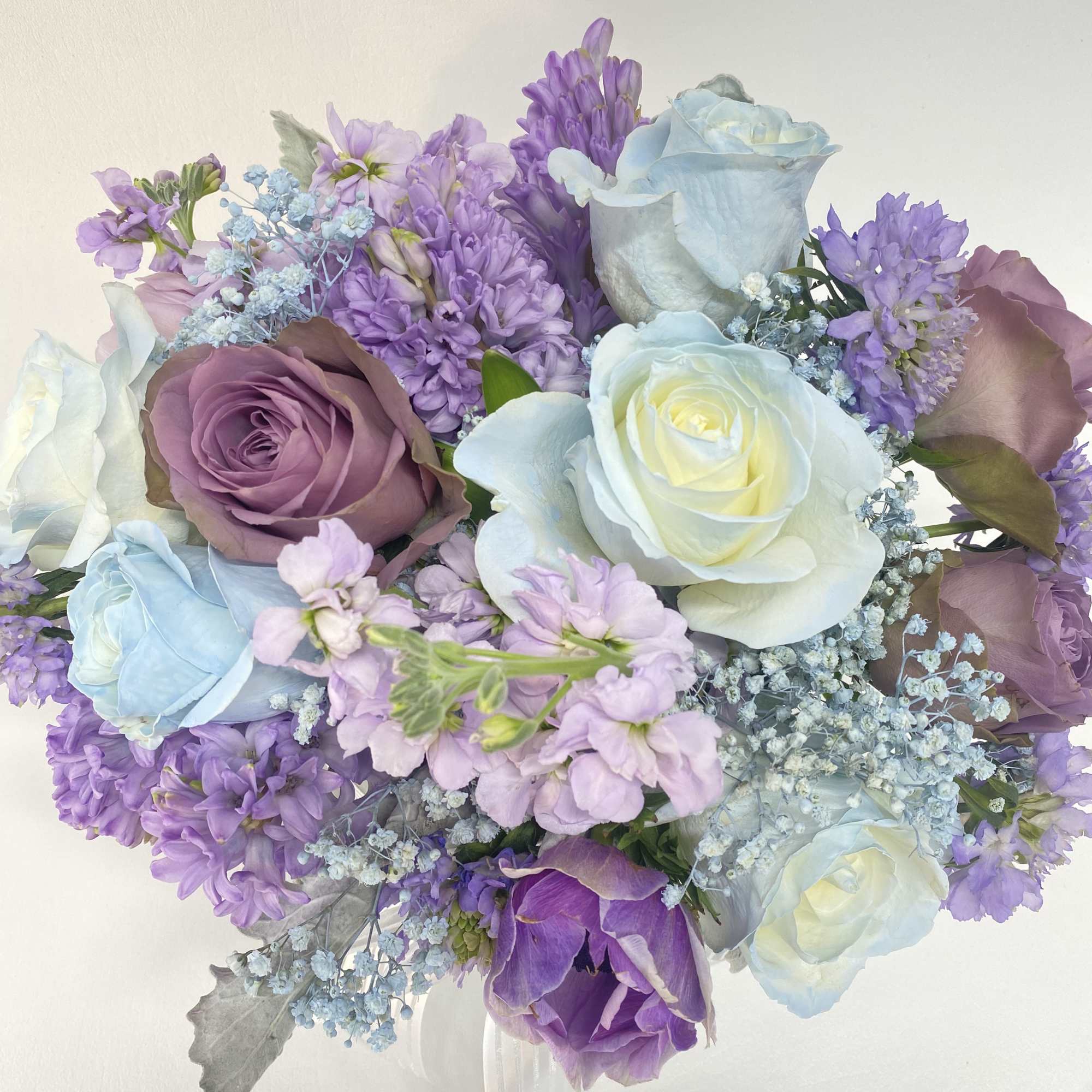 Soft, dreamy flower arrangement with vintage look roses will make your loved